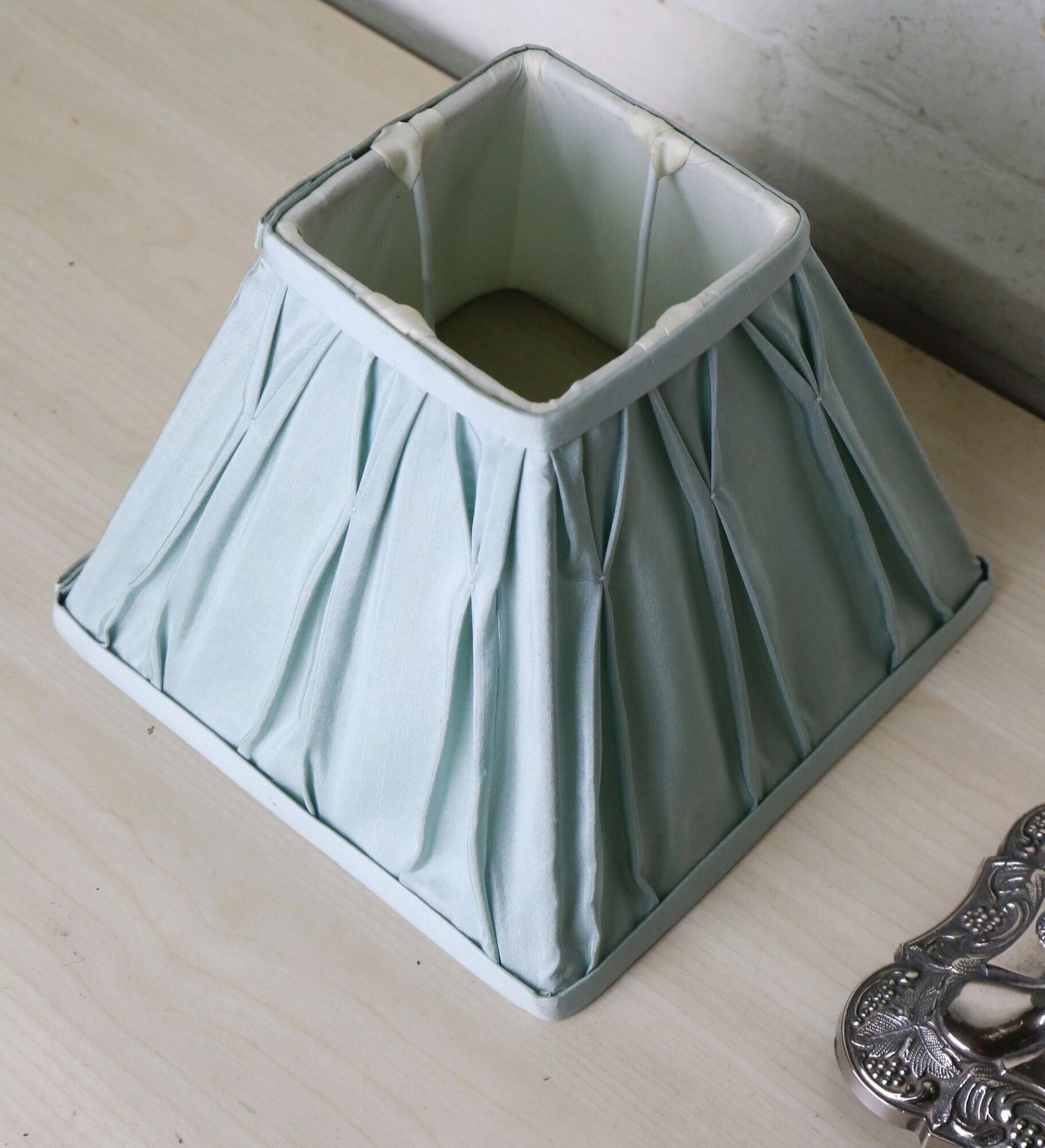 A Vintage Silver Plated Table Lamp With Ornate Castings With A Pale Sage Pinch Pleated Lampshade photo for sale