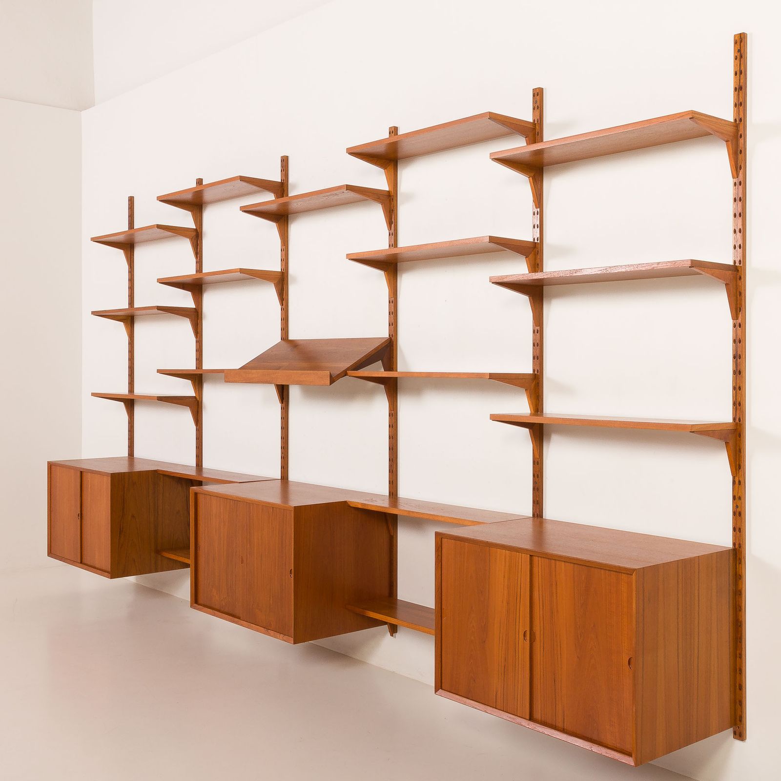 photo furniture Poul Cadovius Extra Large Teak Wall Unit For Cado, 1960s.