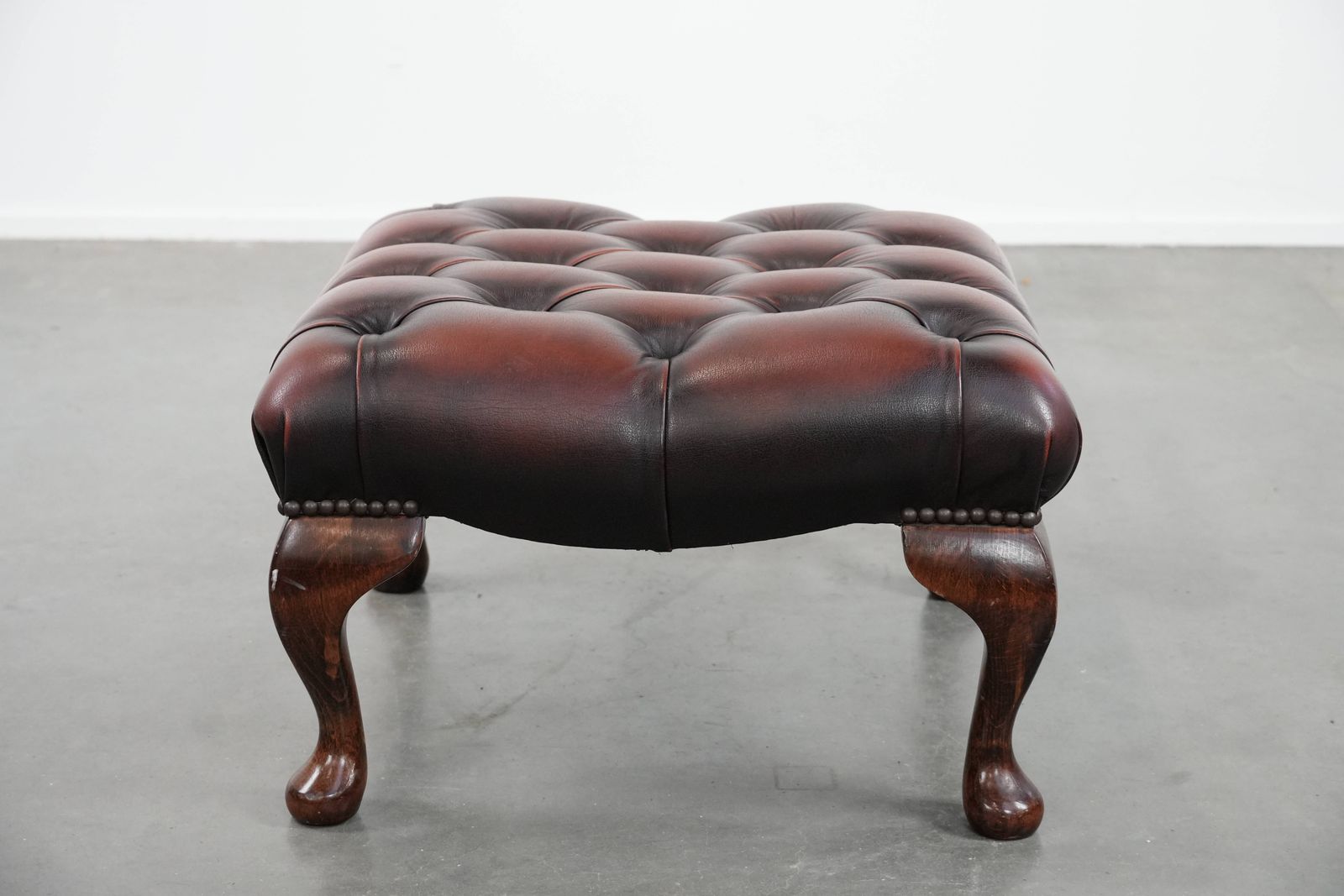 Elegant And Graceful Dark Brown Chesterfield Footstool Made Of Cowhide photo for sale