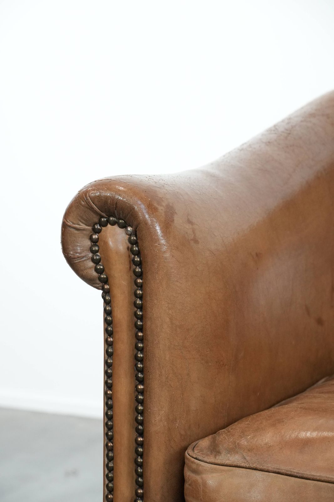 photo for sale Characterful Club Armchair Made Of Sheepskin With Beautiful Light Cognac Colors