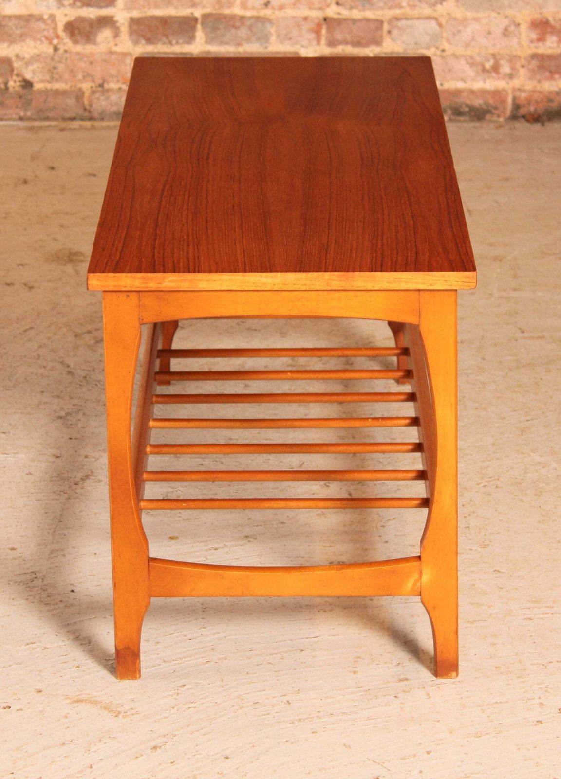 photo furniture Mid Century Teak Coffee Table With A Magazine Rack, Circa 1960s