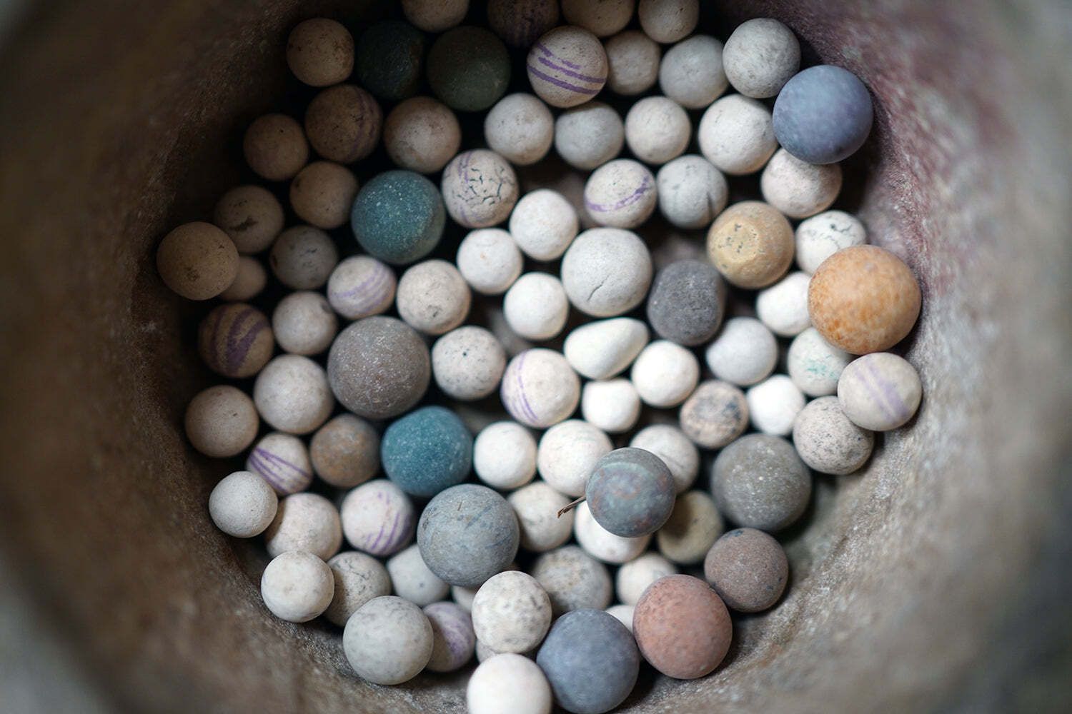 420.0 A Late 19thc Indian Marble Bowl Containing A Collection Of Clay & Glass Marbles photo