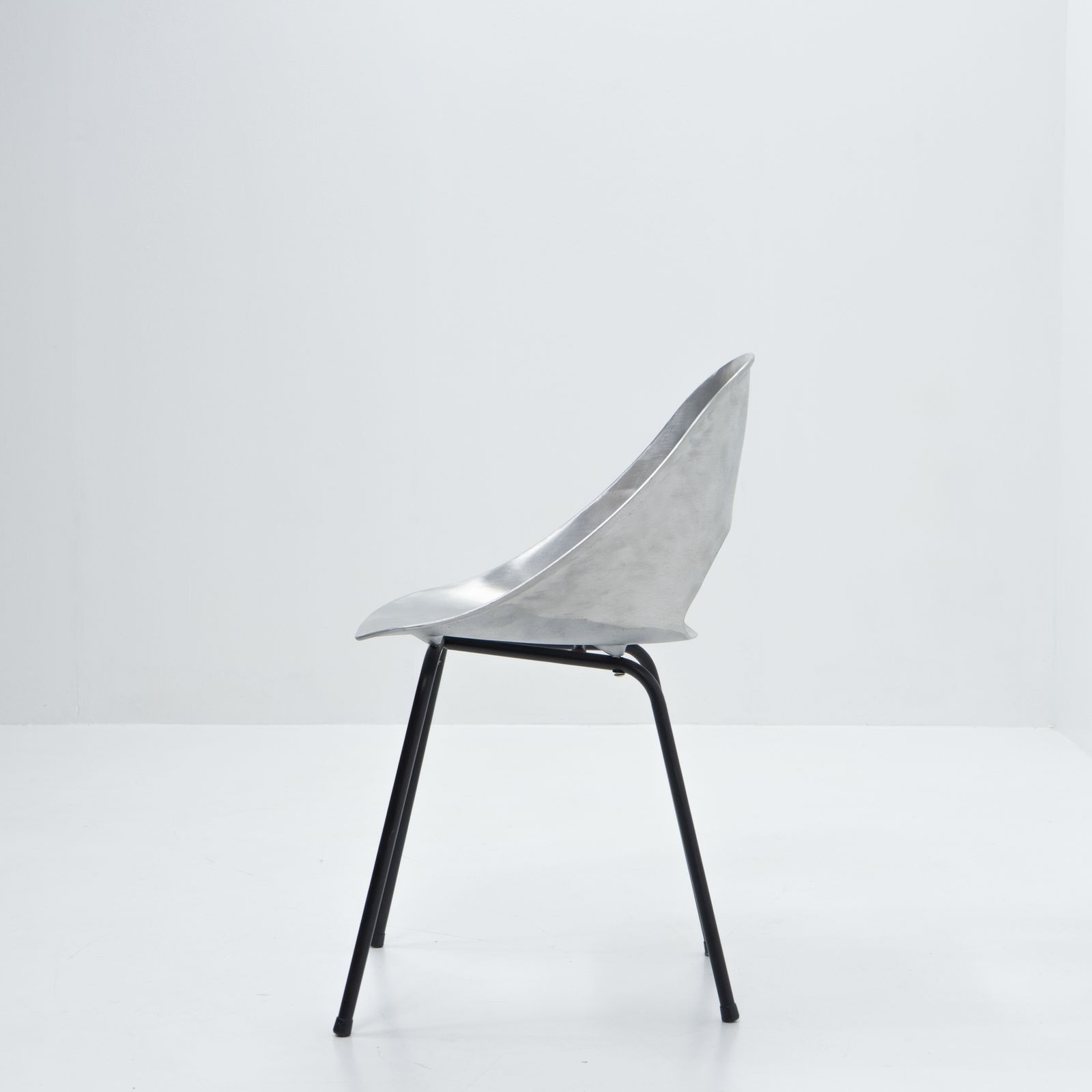 Aluminum Tonneau Chair By Pierre Guariche For Steiner, 1950s photo vinterior