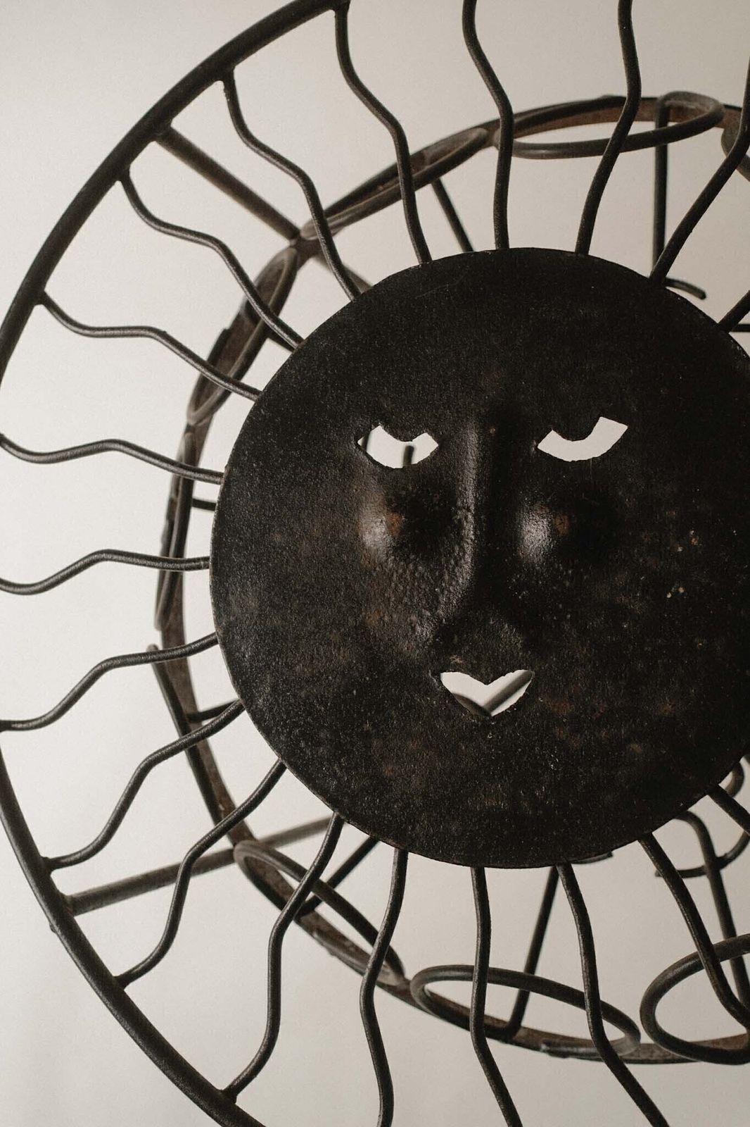 Sculptural Iron Table With Sunburst Face photo Garden Furniture