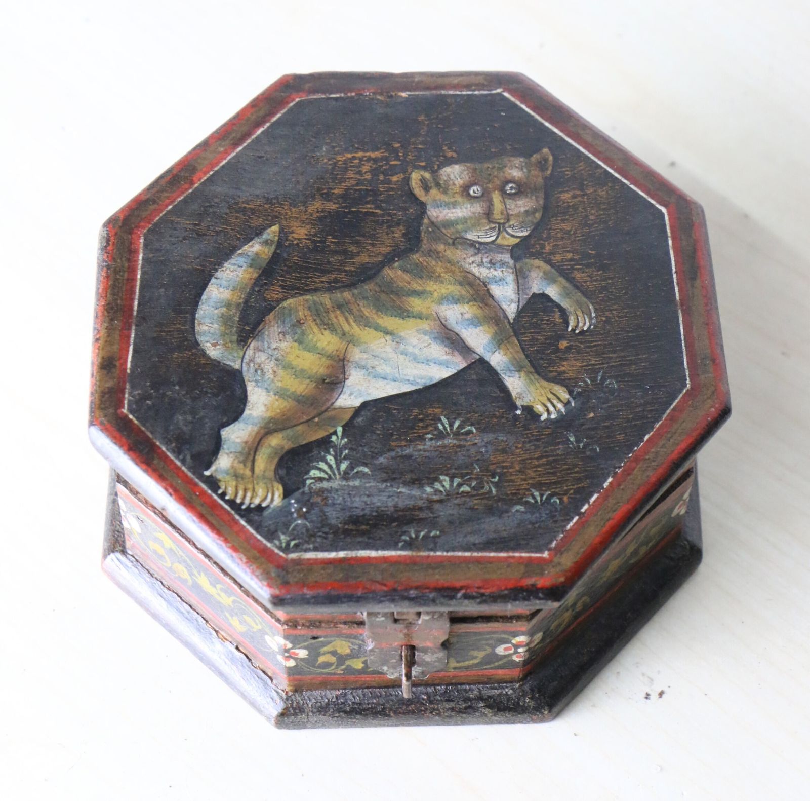 An Antique Indian Hand Painted Octagonal Trinket Box With A Stylised Tiger Design photo for sale