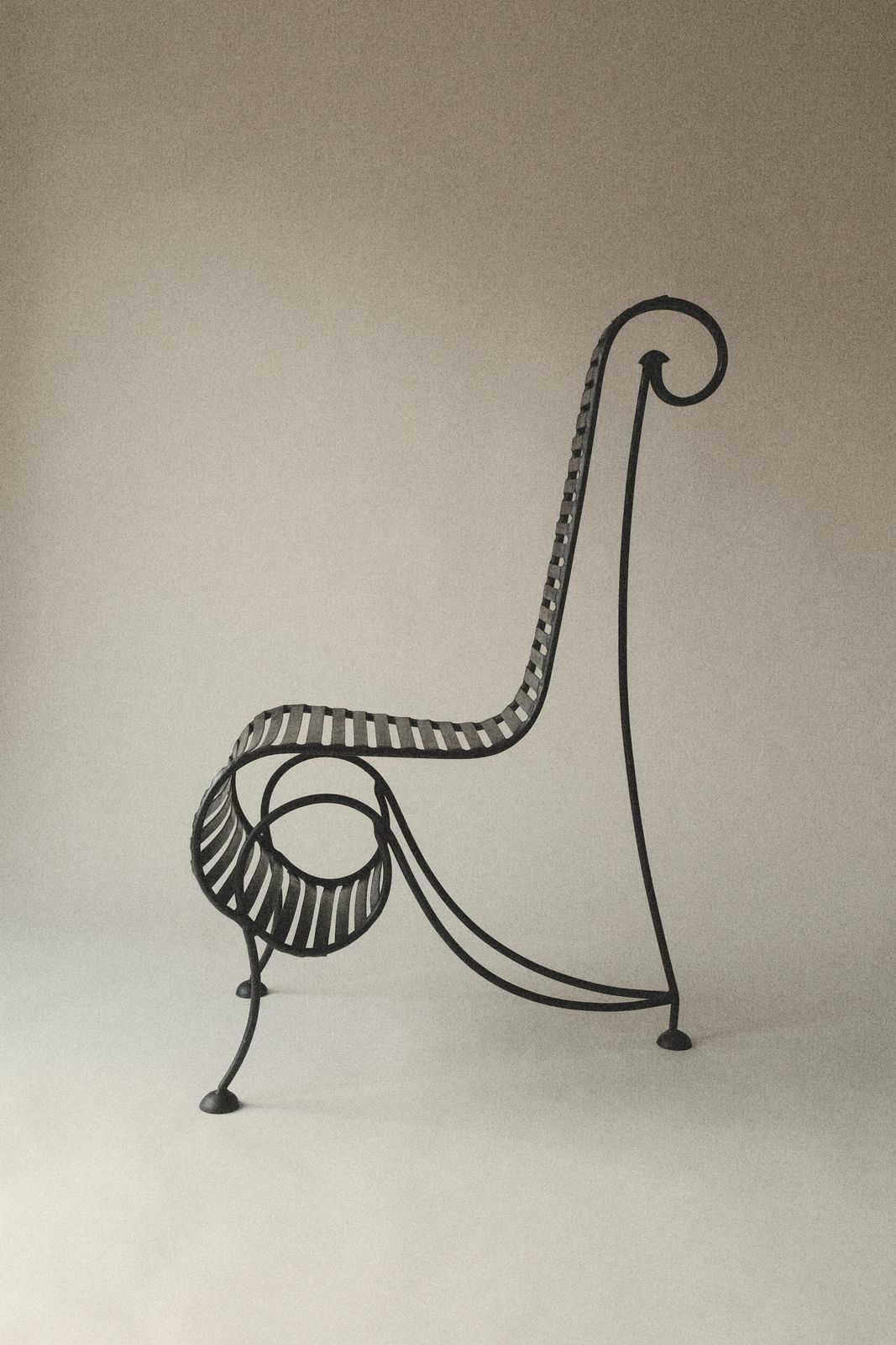 Spine Chair In The Manner Of André Dubreuil photo for sale