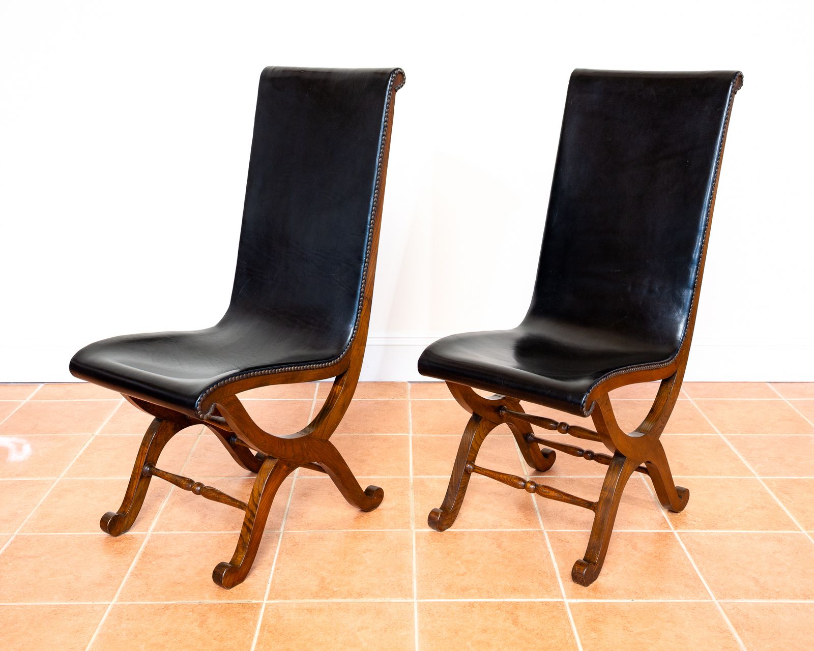 Pair Of Spanish Oak Leather Dining Chairs By Pierre Lottier Valmazan Mid Century Neoclassical Colonial 1960s Black Leather Sling Seat Studded Leather photo 3650.0
