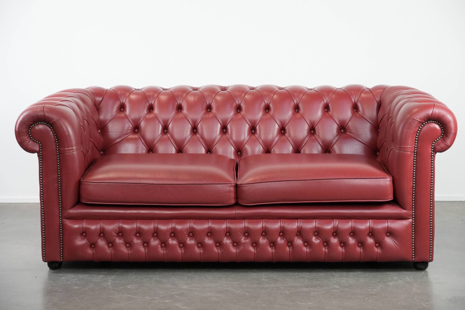 Wonderful Set Consisting Of An English Cowhide Chesterfield 2.5 Seater Sofa And Matching Armchair In A Stunning Red Colour photo furniture