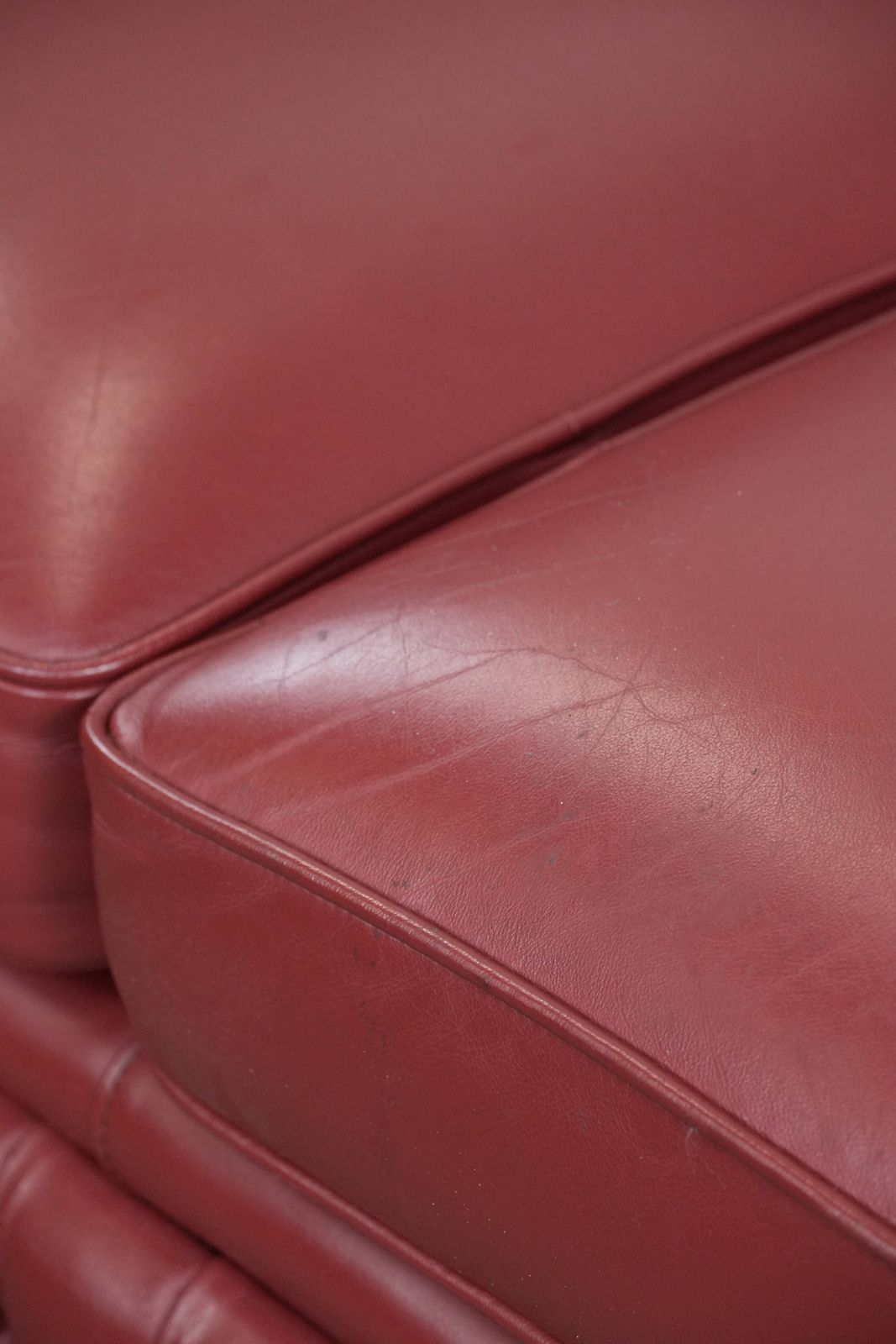 2593.0 Wonderful Set Consisting Of An English Cowhide Chesterfield 2.5 Seater Sofa And Matching Armchair In A Stunning Red Colour photo