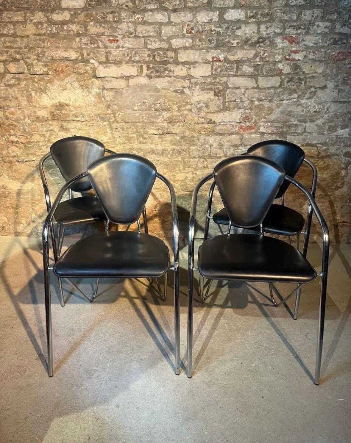 Effezeta Chairs With Black Leather Upholstery And A Chrome / Tubular Steel Frame