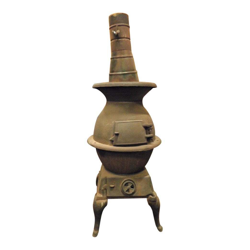 Dark Wrought Iron Stove, Typically From The Italian Valleys