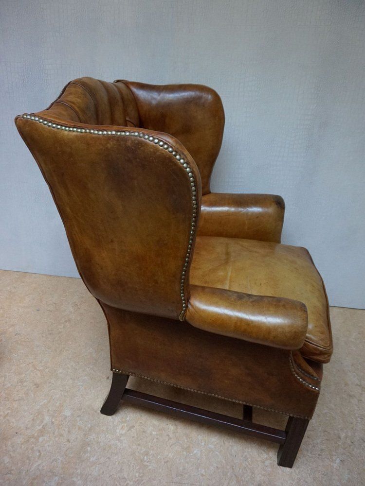 photo for sale Mid Century Cognac Leather Chesterfield Wingback Armchair, 1960s