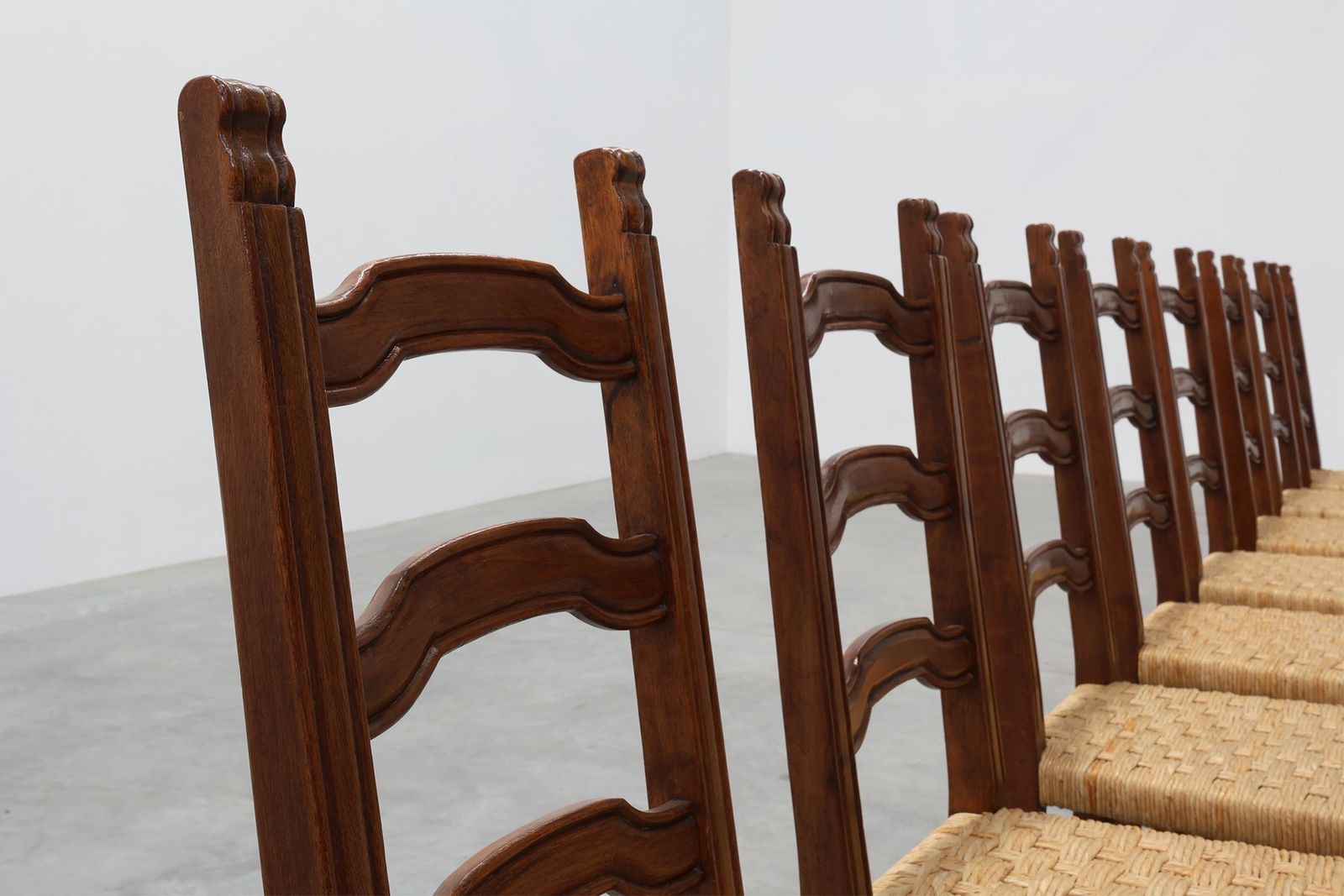 photo for sale Mid Century Brutalist Chairs In Wood And Wicker, Belgium, 1970s, Set Of 8