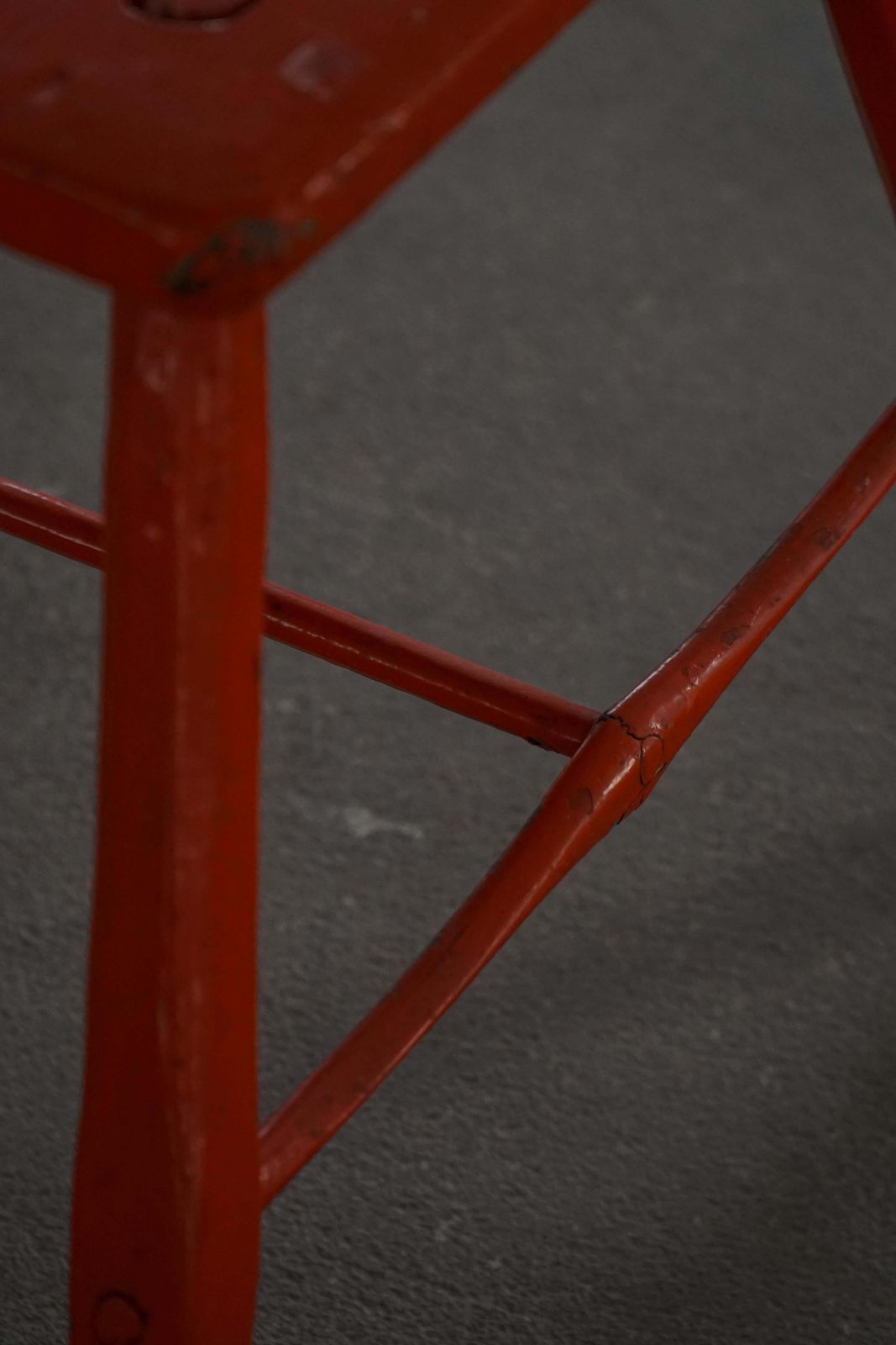 photo furniture Pair Of Patinated Red Painted Wooden Stools With Splayed Legs, 1950s–1960s