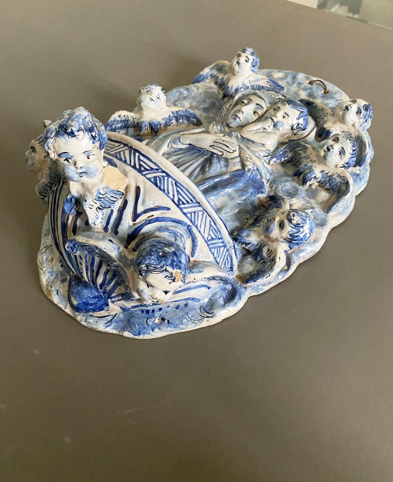 photo for sale Italy Mid 20th Century White And Blue Pottery Holy Water Font With Little Angels