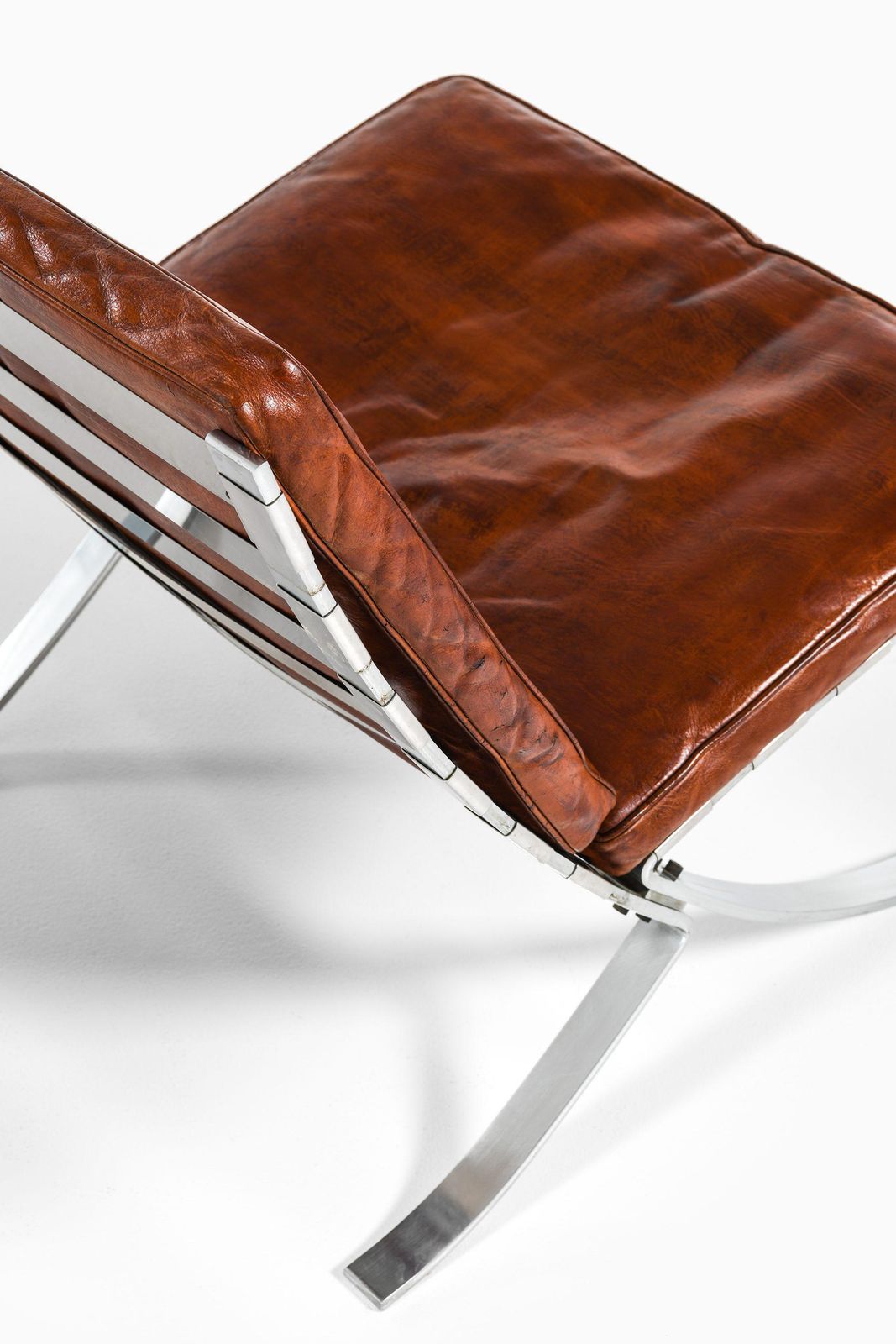 Pair Of Easy Chairs In Chromed Steel And Leather By Steen østergaard, 1960's photo vinterior