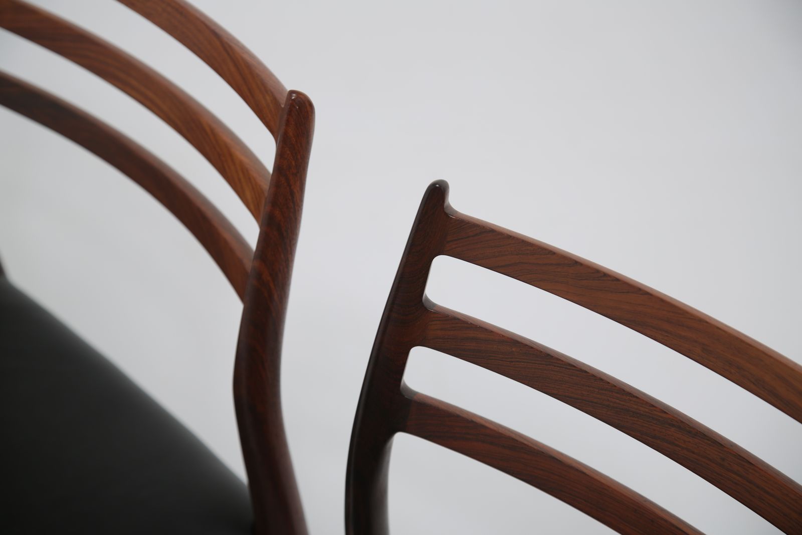 photo buy Niels Otto Møller Model 78 Dining Chairs: Set Of 8 In Solid Rosewood And Black Leather For J.L. Møllers, 1960s.