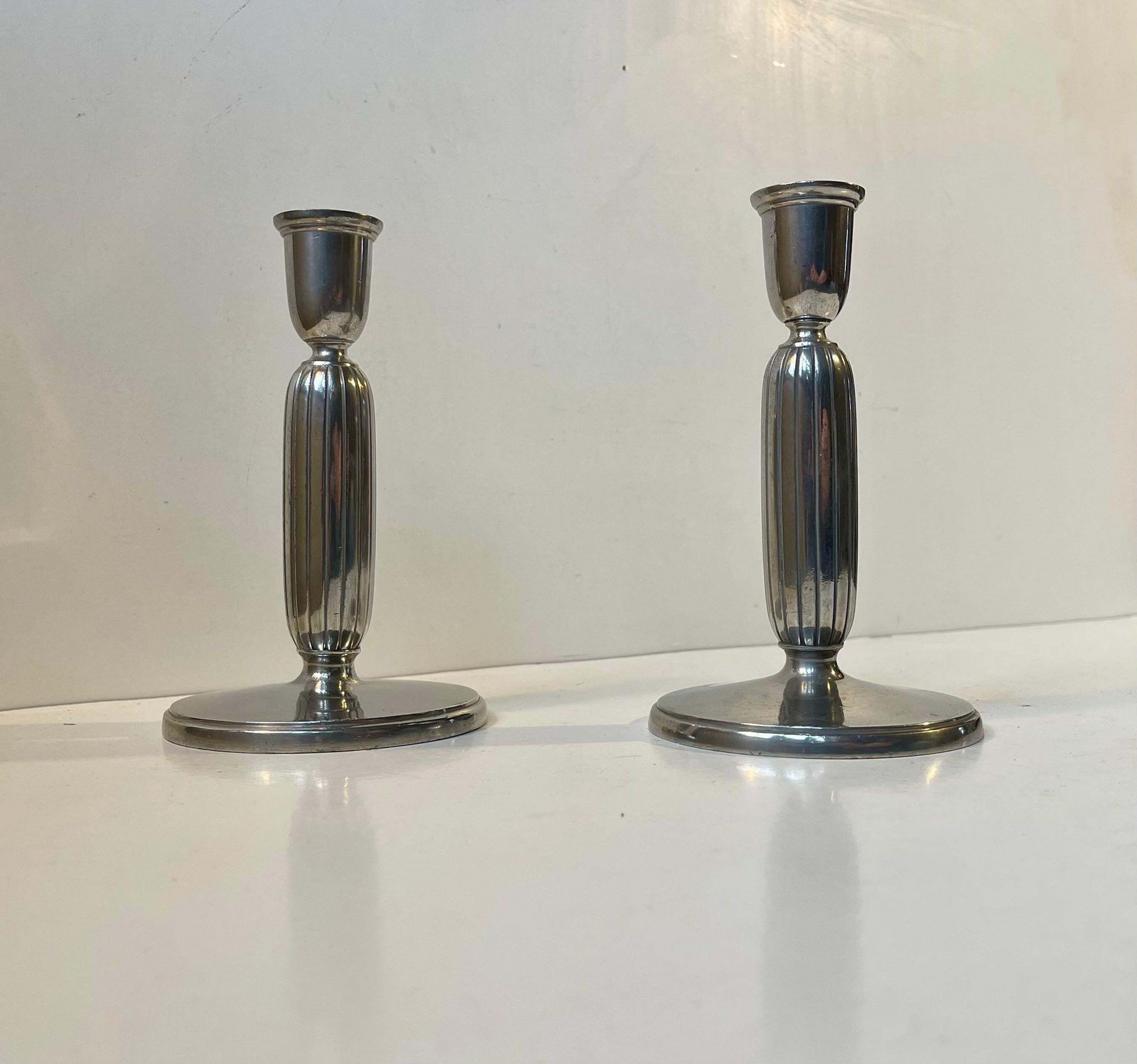 Just Andersen   A Pair Of Art Deco Column Candlesticks In Pewter, 1930s photo vintage