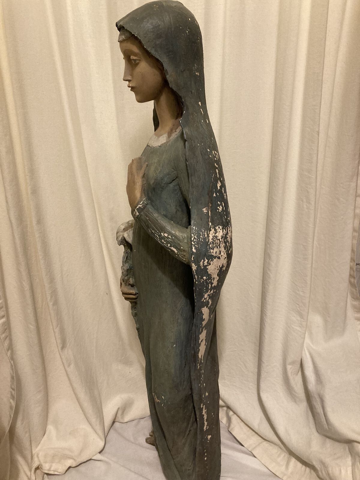 Antique Statue Of The Young Virgin Mary Holding A Lily. photo for sale