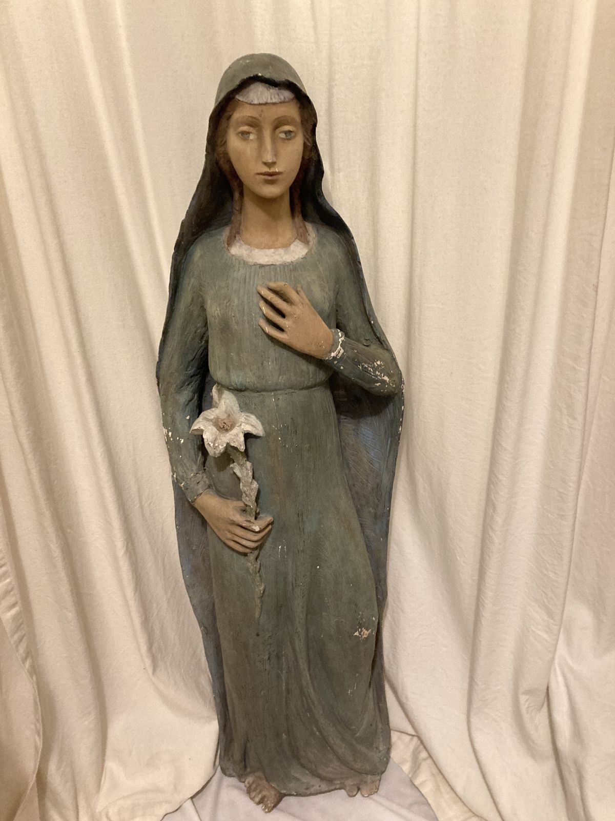 Antique Statue Of The Young Virgin Mary Holding A Lily. photo Art