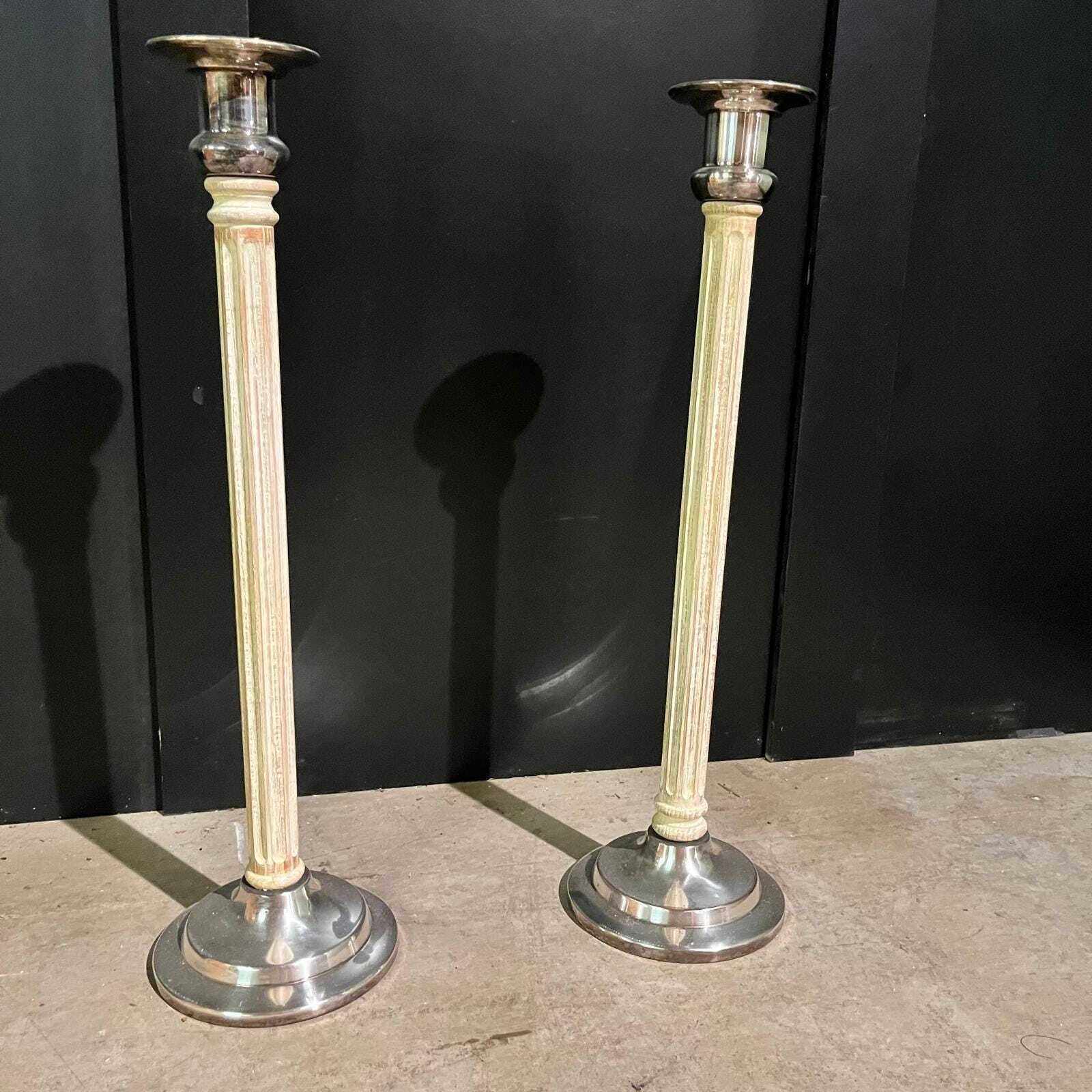 A Pair Of Tall Vintage Candle Sticks photo for sale