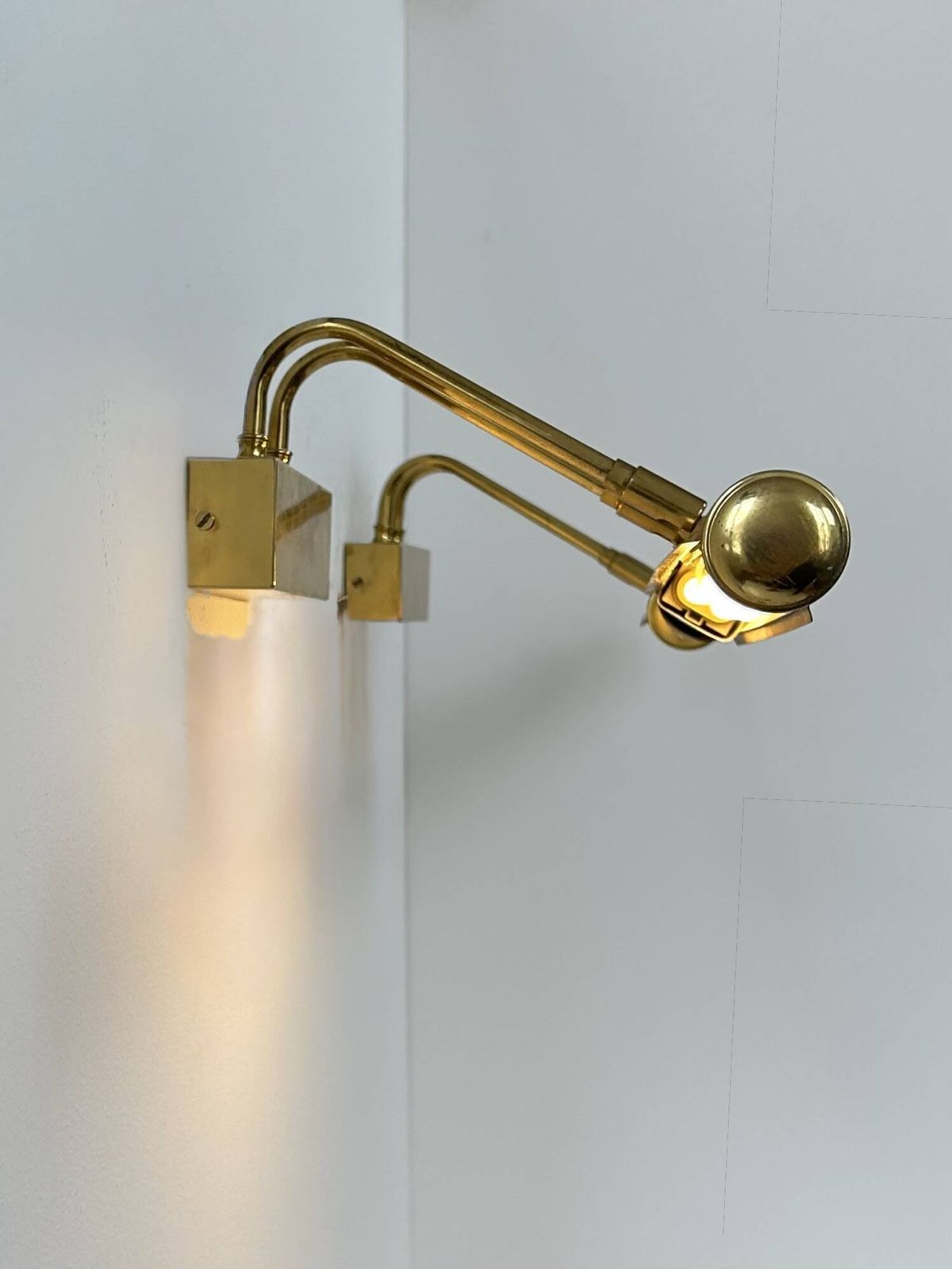 Pair Of Vintage Adjustable Wall Lights In Patinated Brass, France, 1970. photo furniture