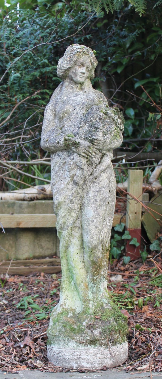 photo vinterior Garden Statue Of Flower Maiden. Reconstituted Stone