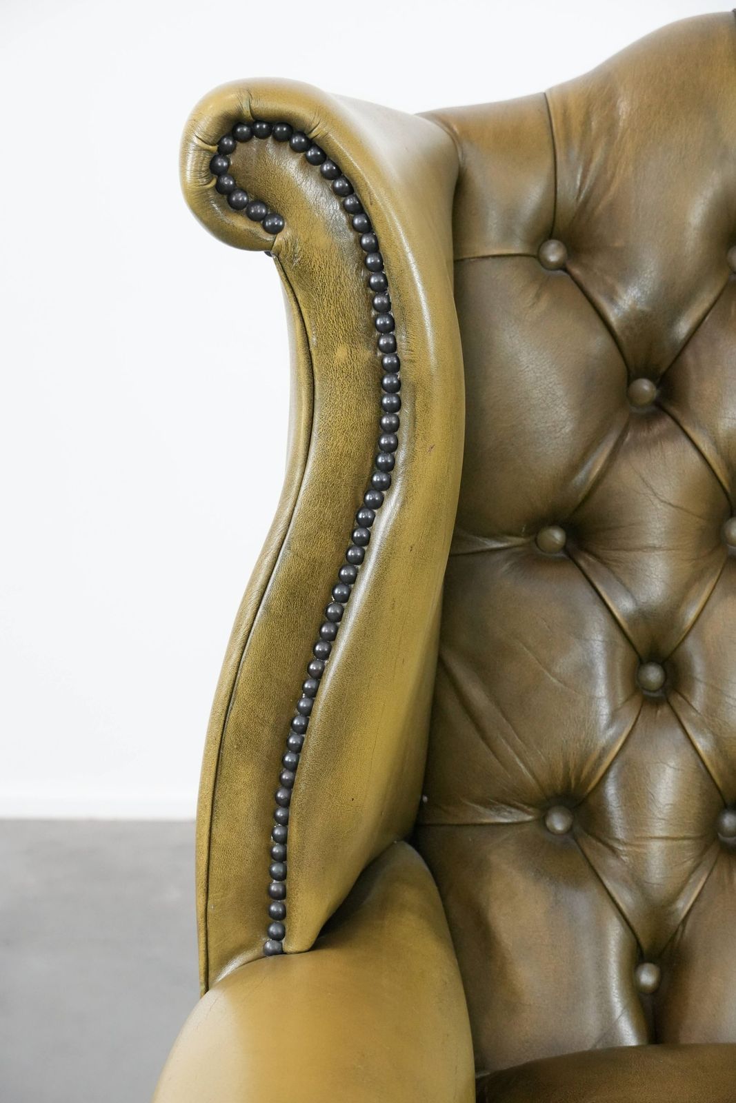 photo for sale Moss Green Cowhide Chesterfield Wingback Armchair In English Style Finished With Decorative Nails