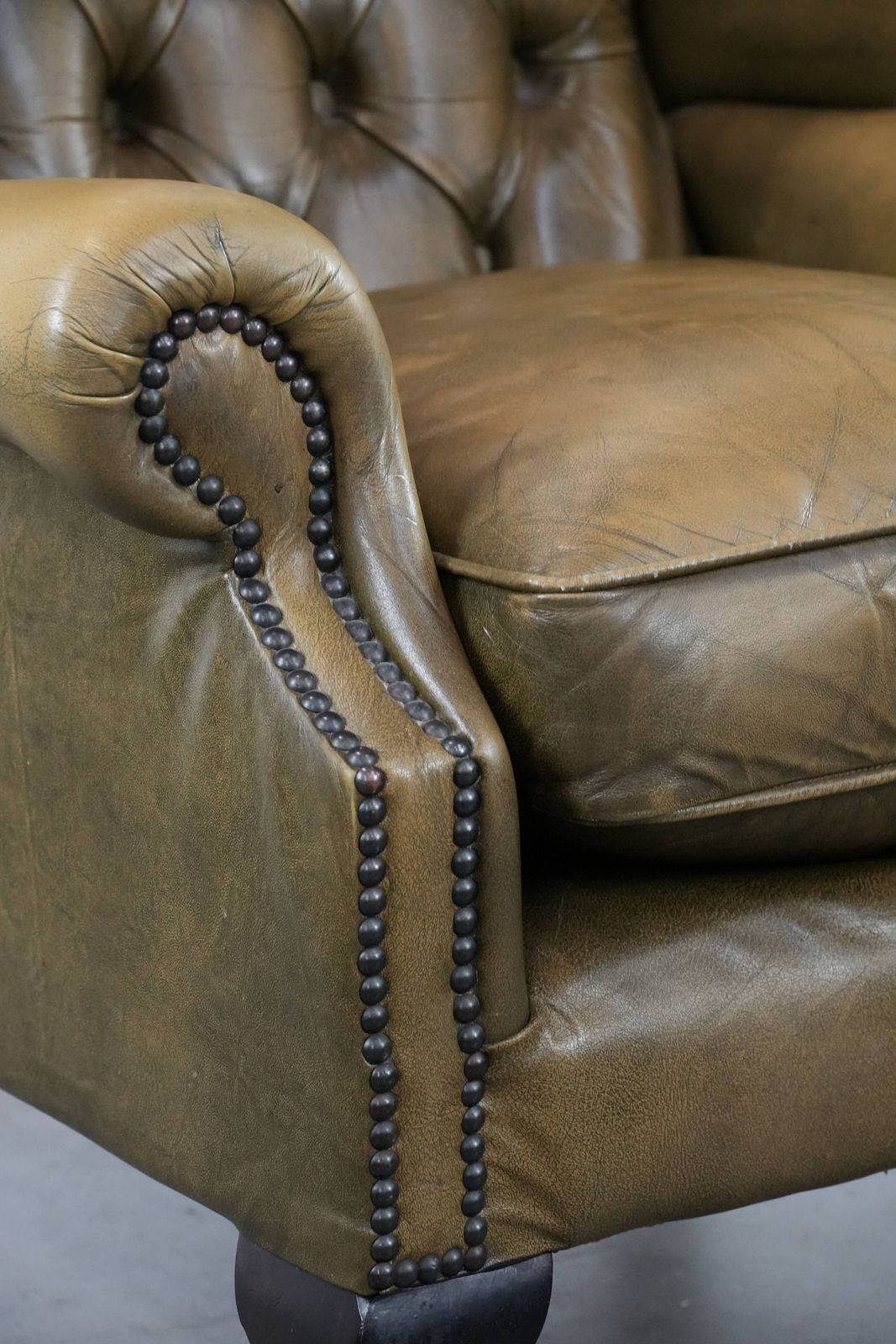 Furniture Moss Green Cowhide Chesterfield Wingback Armchair In English Style Finished With Decorative Nails photo