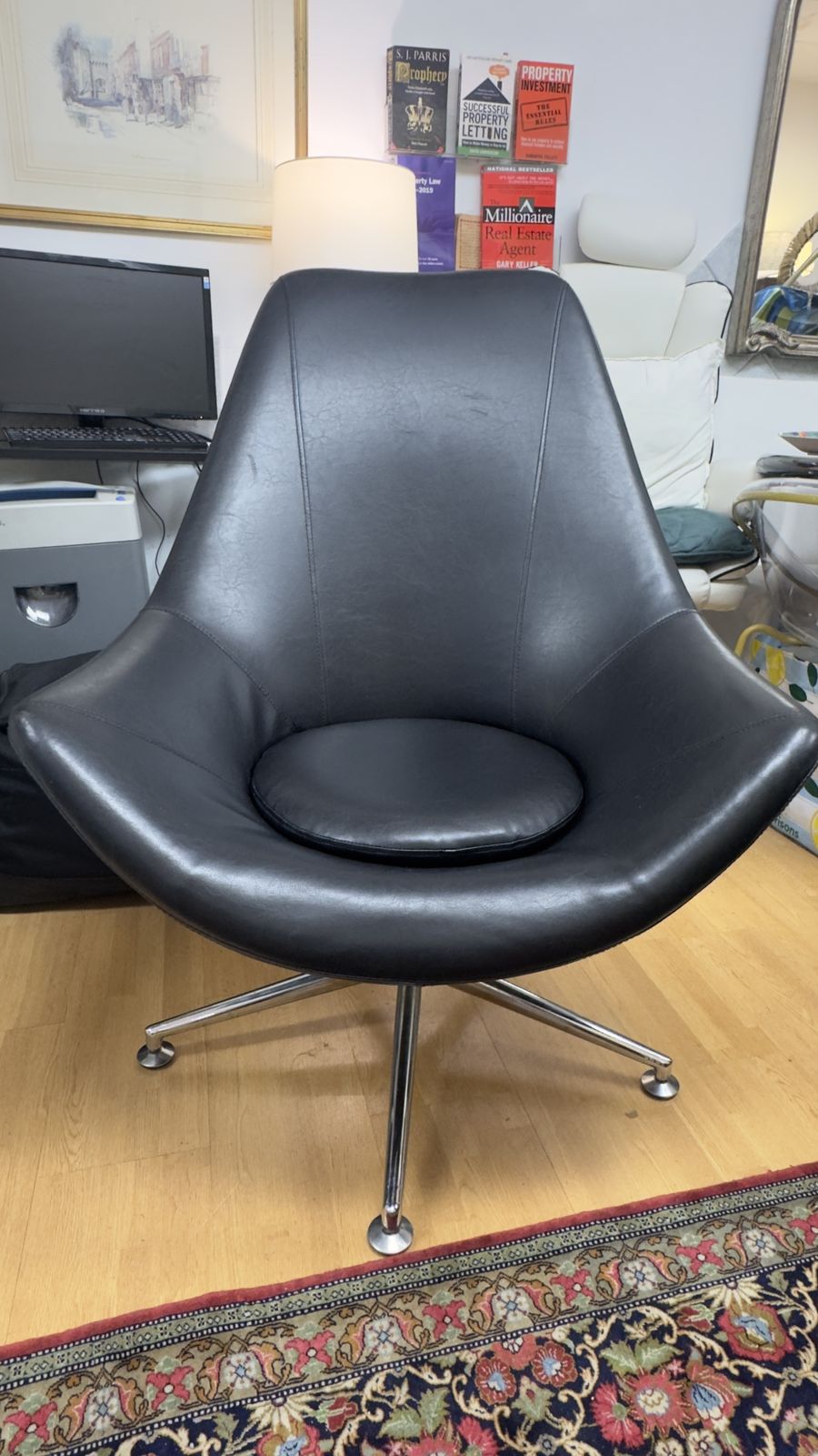 Retro High Backed Black Leather Swivel Armchair