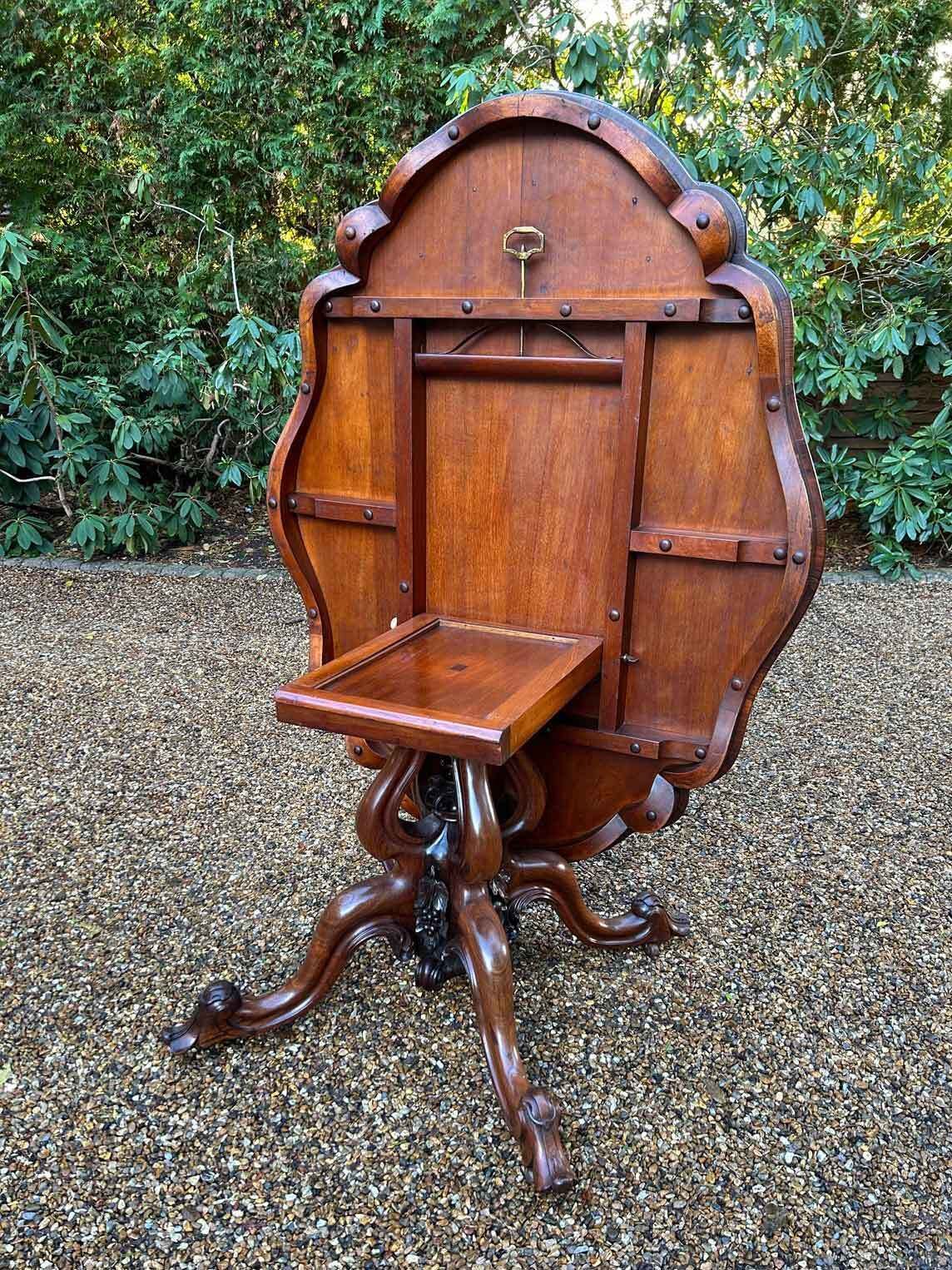 photo furniture William IV Rosewood Tilt Top Oval Serpentine Dining Table