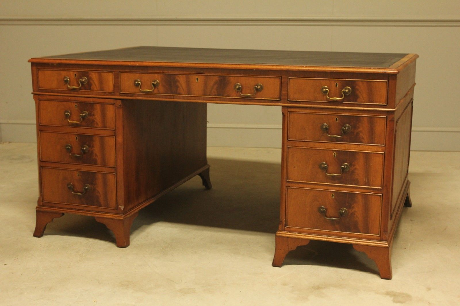 An Early 20th Century Curl Mahogany Partners Desk photo vinterior