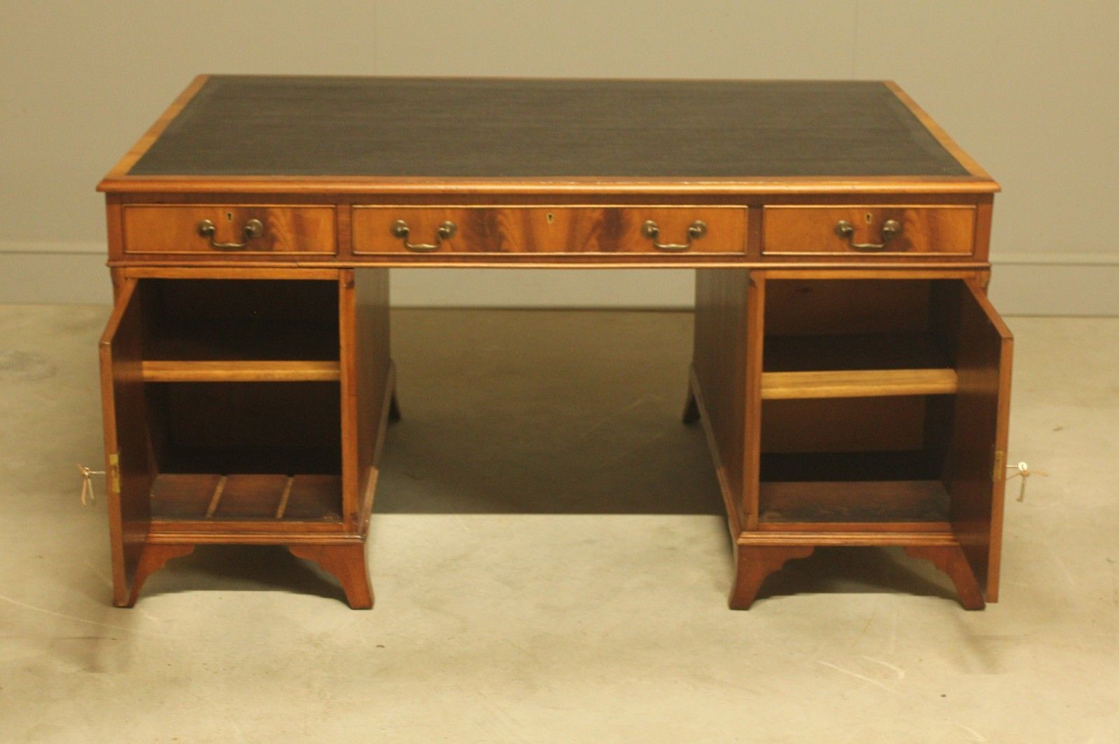 photo furniture An Early 20th Century Curl Mahogany Partners Desk