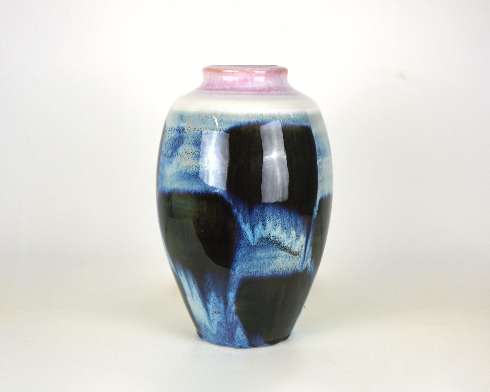 A Mid Century Blue Flambe Glazed Pottery Vase With Pink Rim