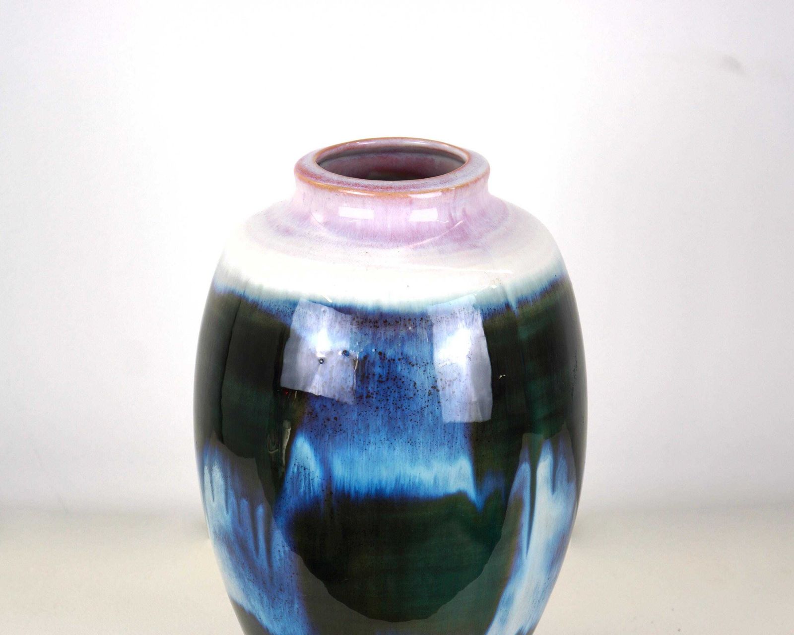 A Mid Century Blue Flambe Glazed Pottery Vase With Pink Rim photo for sale