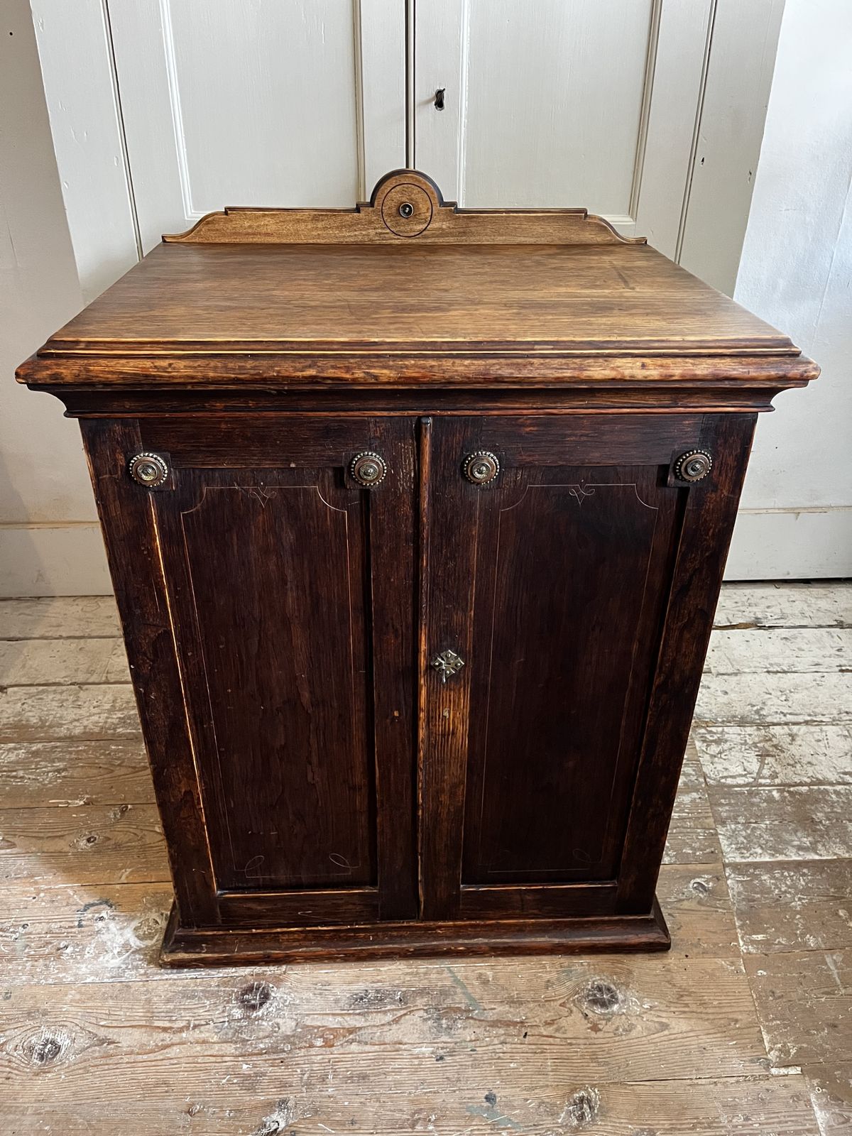 A Deep Victorian Aesthetic Movement Cupboard With Drawer