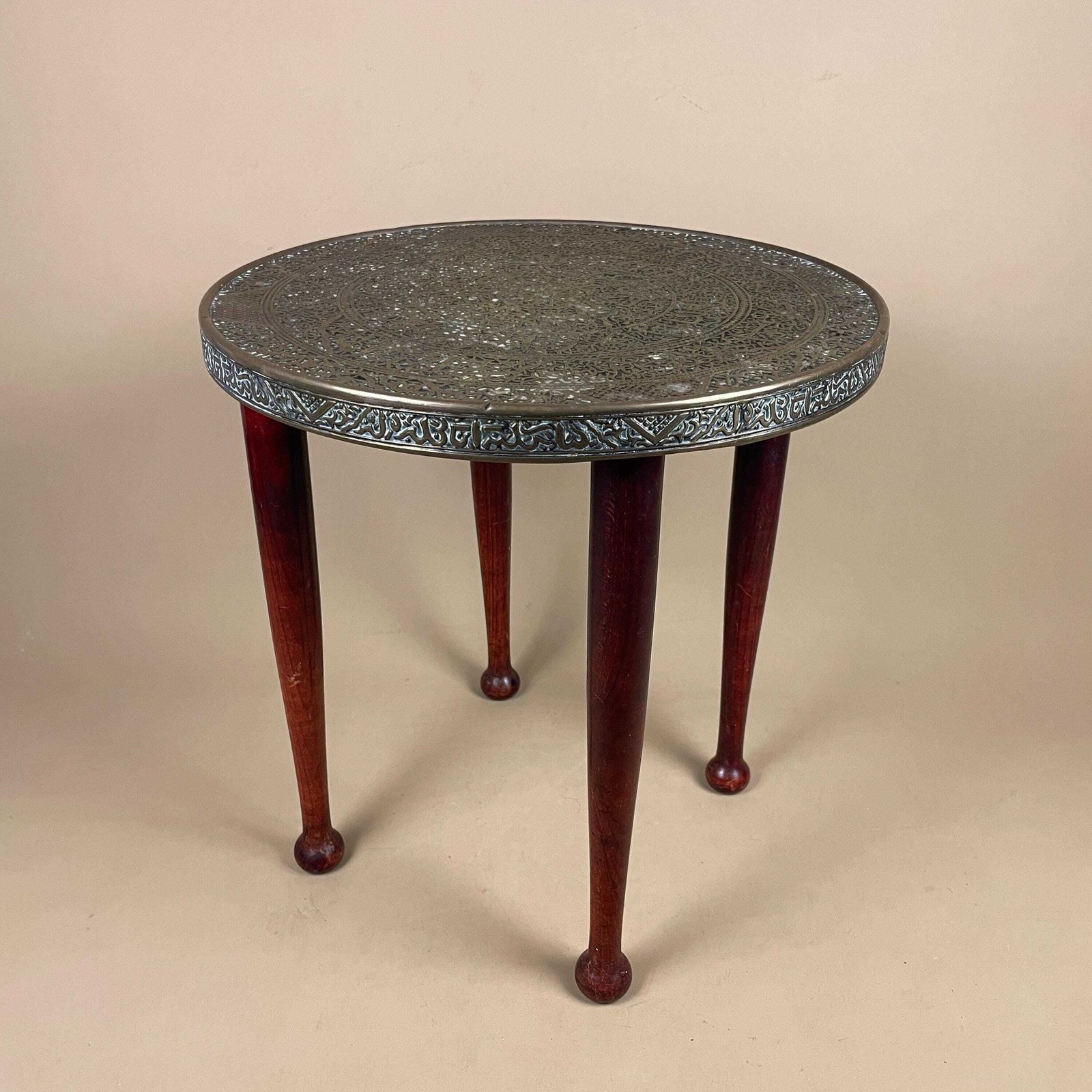 Antique Metal Gold Brass Indian Table Patterned Tray Top Asian Handmade Intricate Decorative Round Coffee Side Wood Pin Legs Vintage photo Furniture