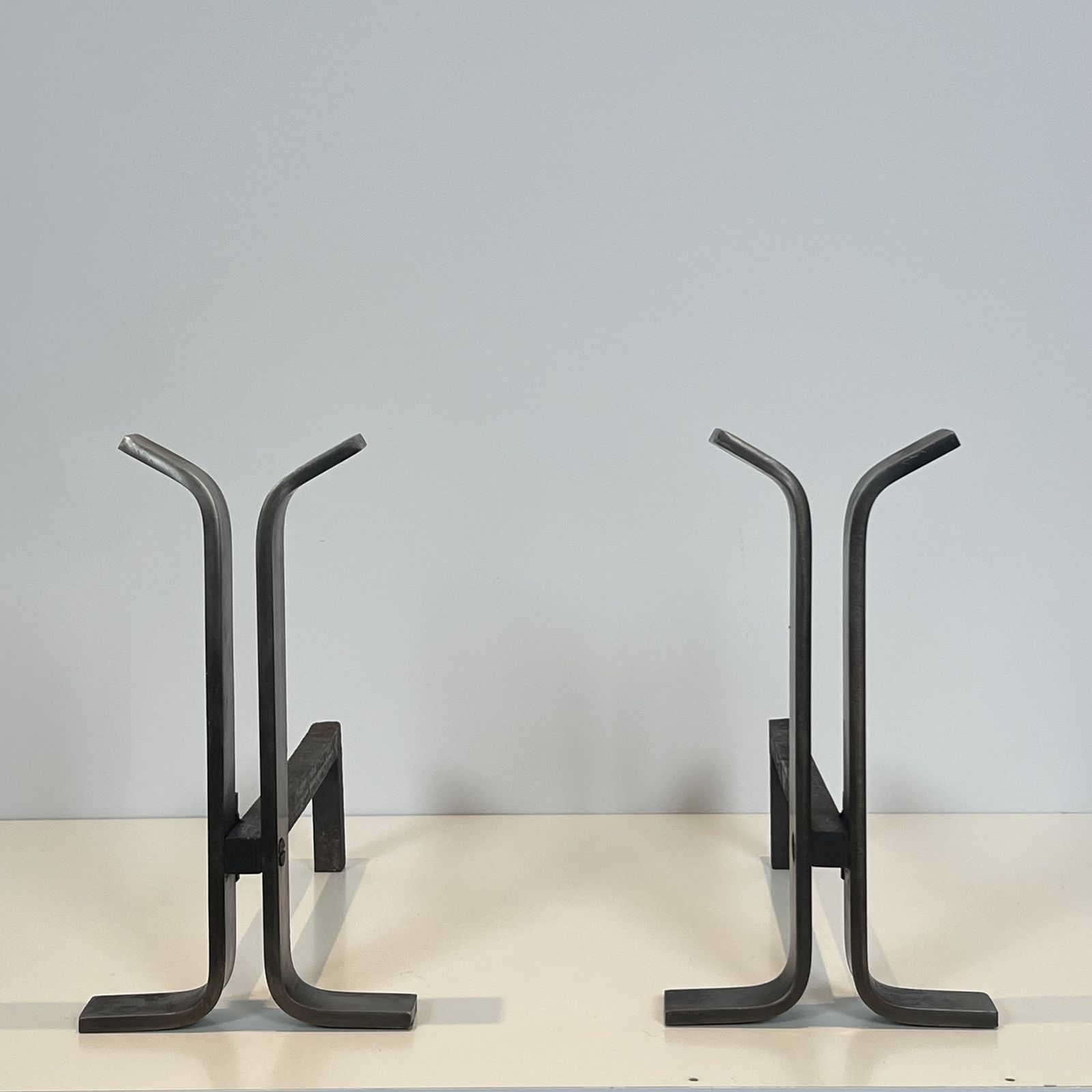 Pair Of Modernist Steel And Wrought Iron Andirons photo for sale