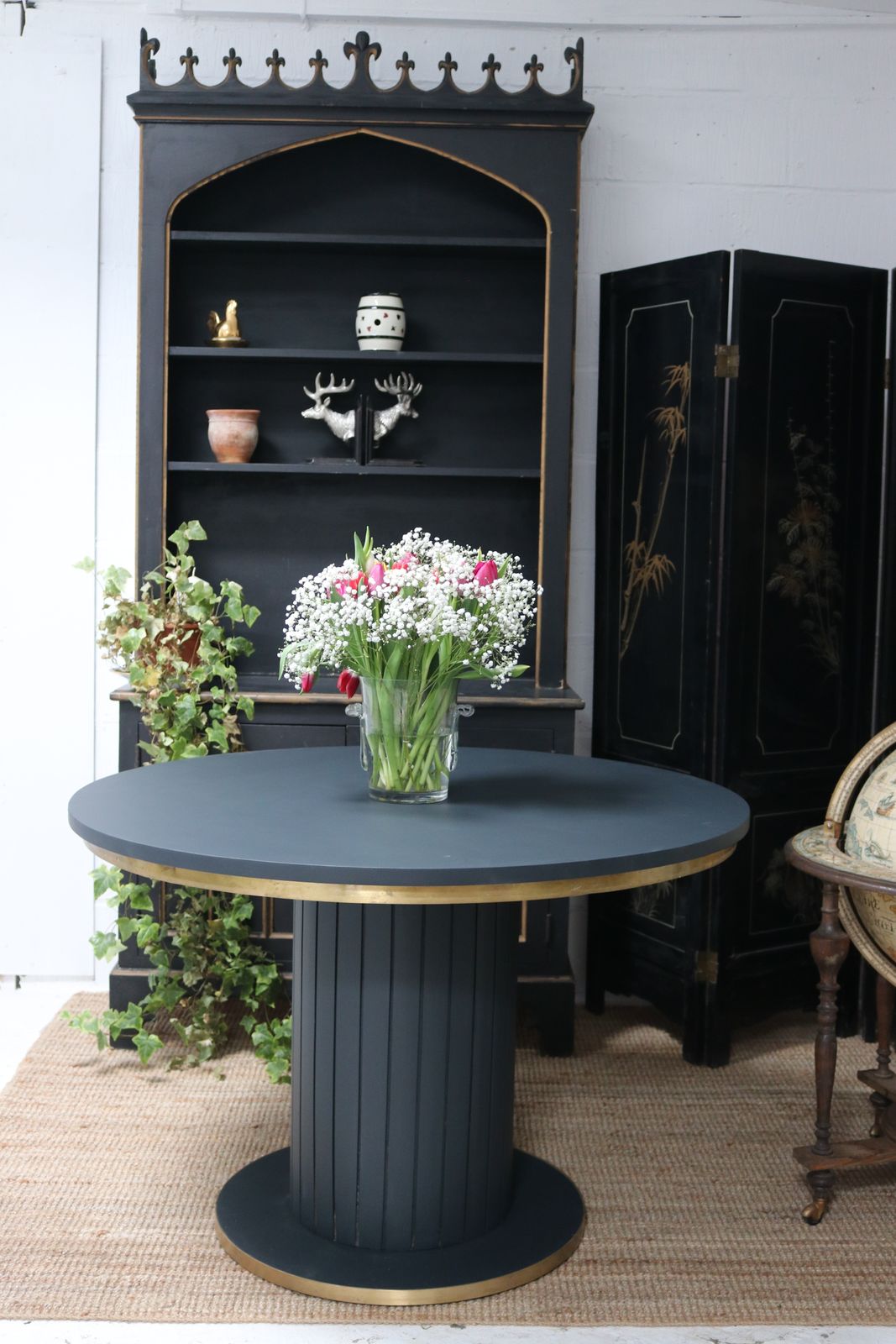 Stunning Black Round Dining Table With Brass Metal Edge Slatted Wood Column Base