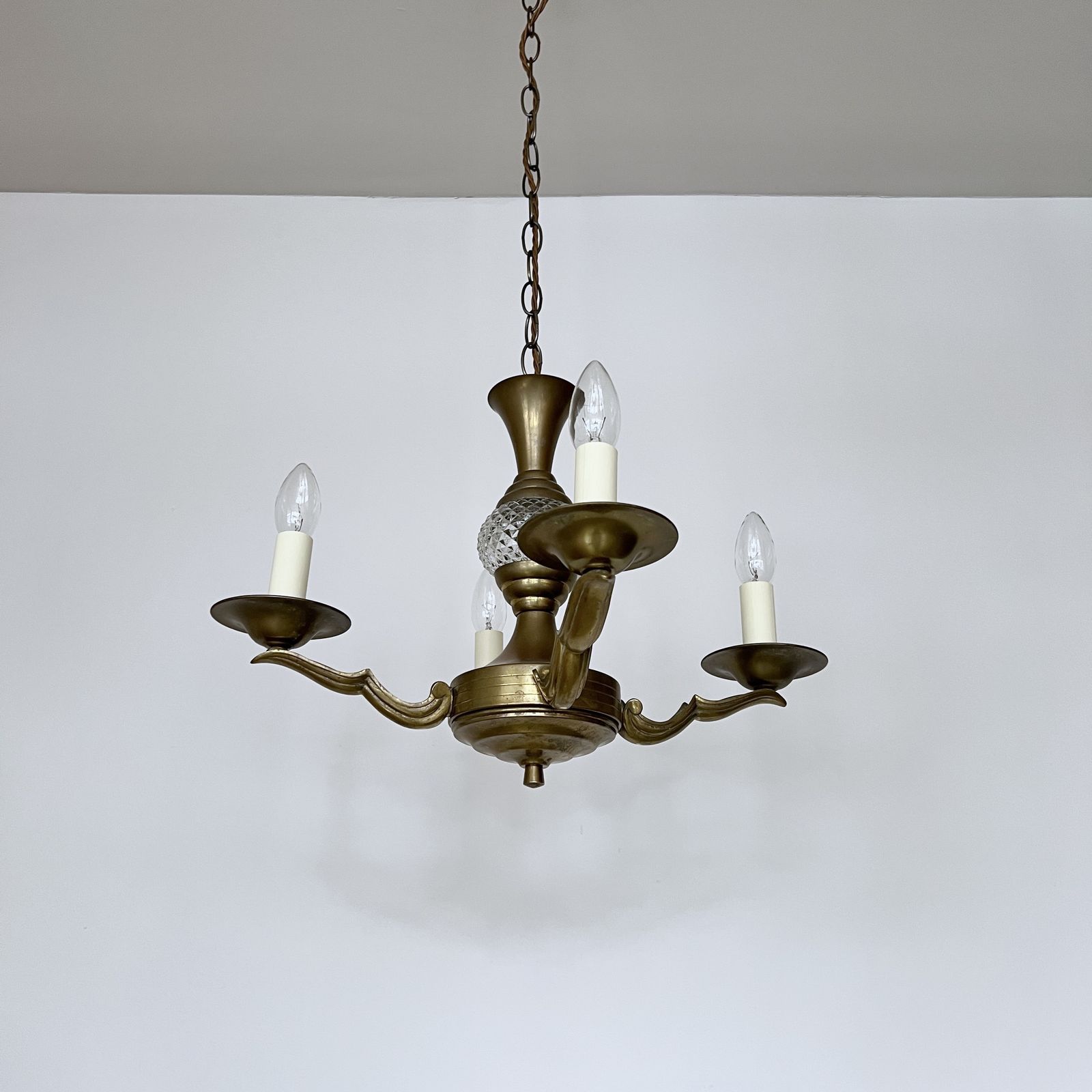 Brass Four Arm Chandelier With Faceted Glass Stem Detail photo furniture