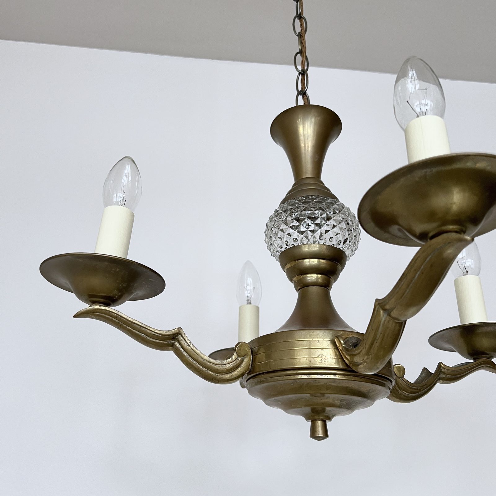 Brass Four Arm Chandelier With Faceted Glass Stem Detail photo Lighting