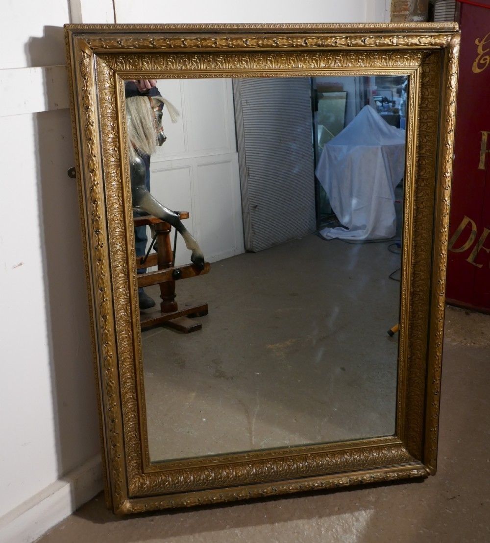 A Large 19th Century Gilt Wall Mirror photo furniture