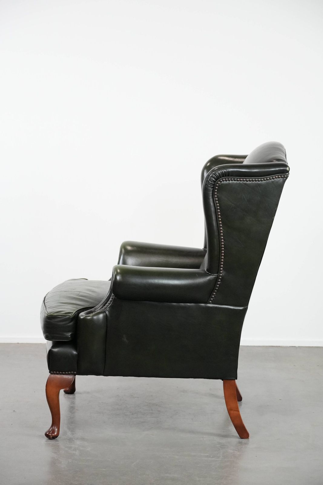 Beautiful Smooth Classic Cowhide Chesterfield Wing Chair In A Stylish Dark Green Color photo 1021.0
