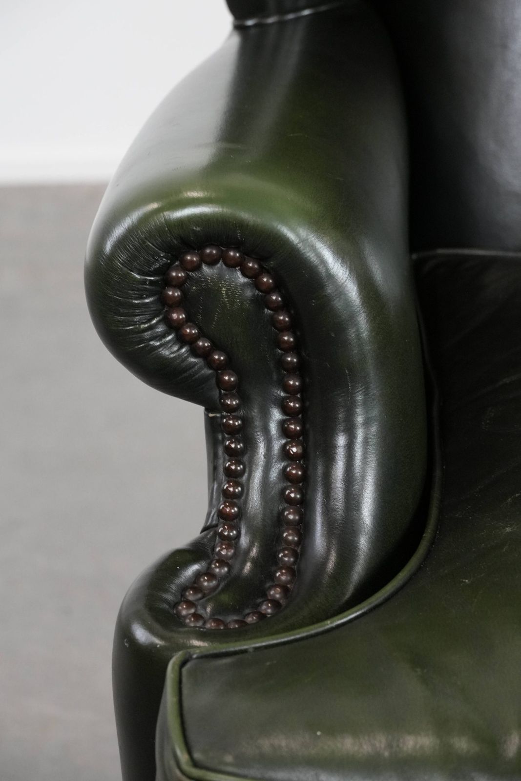 photo for sale Beautiful Smooth Classic Cowhide Chesterfield Wing Chair In A Stylish Dark Green Color