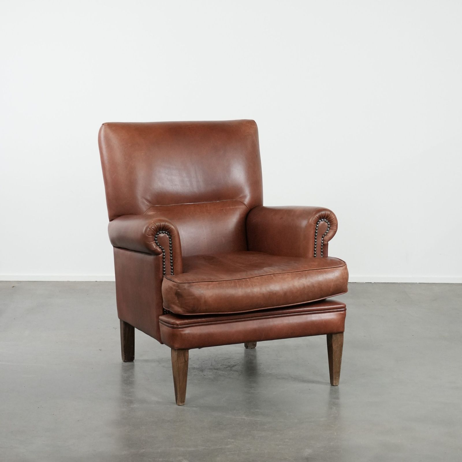 Nice And Comfortable Armchair Made Of Cognac Colored Cowhide In English Style