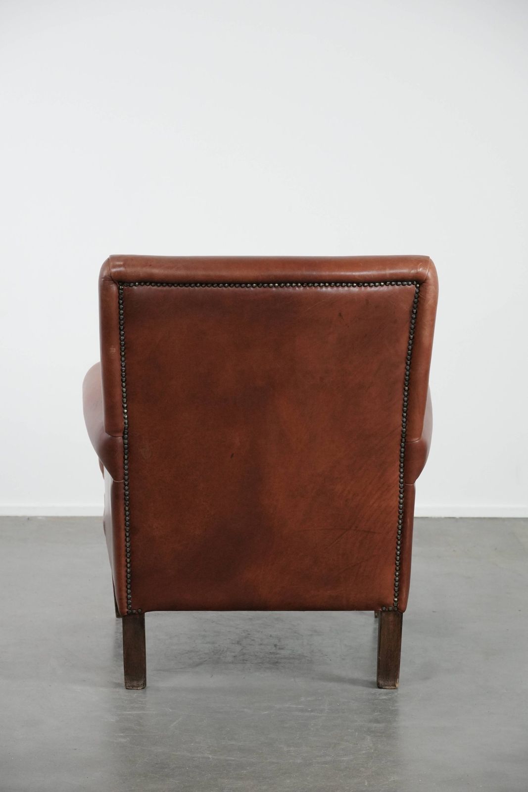 Nice And Comfortable Armchair Made Of Cognac Colored Cowhide In English Style photo Furniture