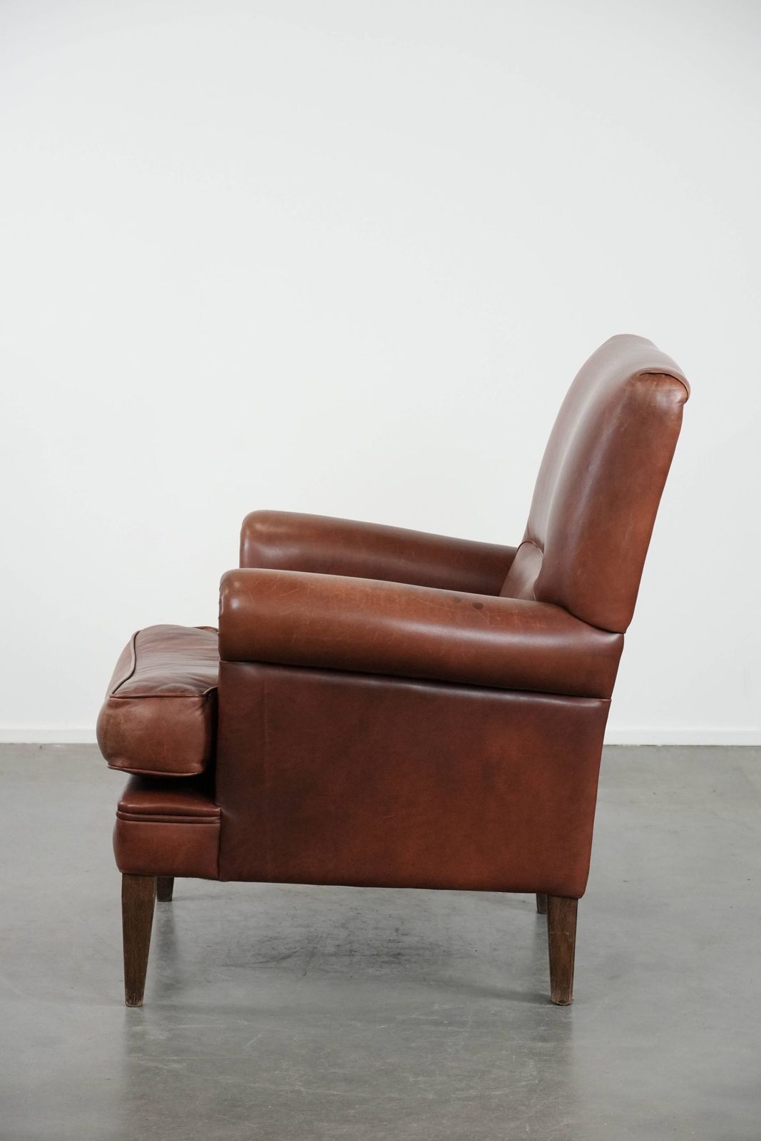 Nice And Comfortable Armchair Made Of Cognac Colored Cowhide In English Style photo 864.0