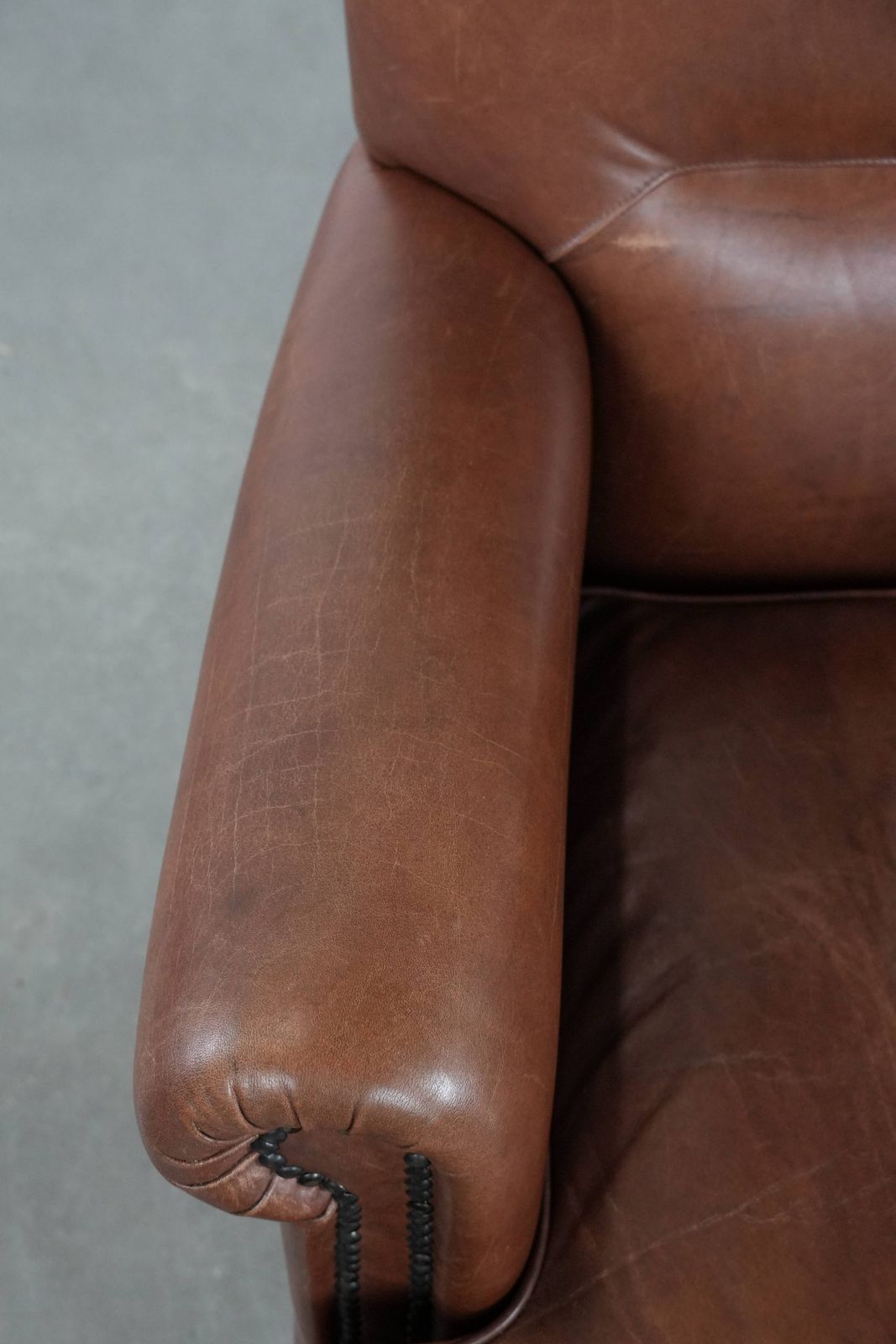 Nice And Comfortable Armchair Made Of Cognac Colored Cowhide In English Style photo buy