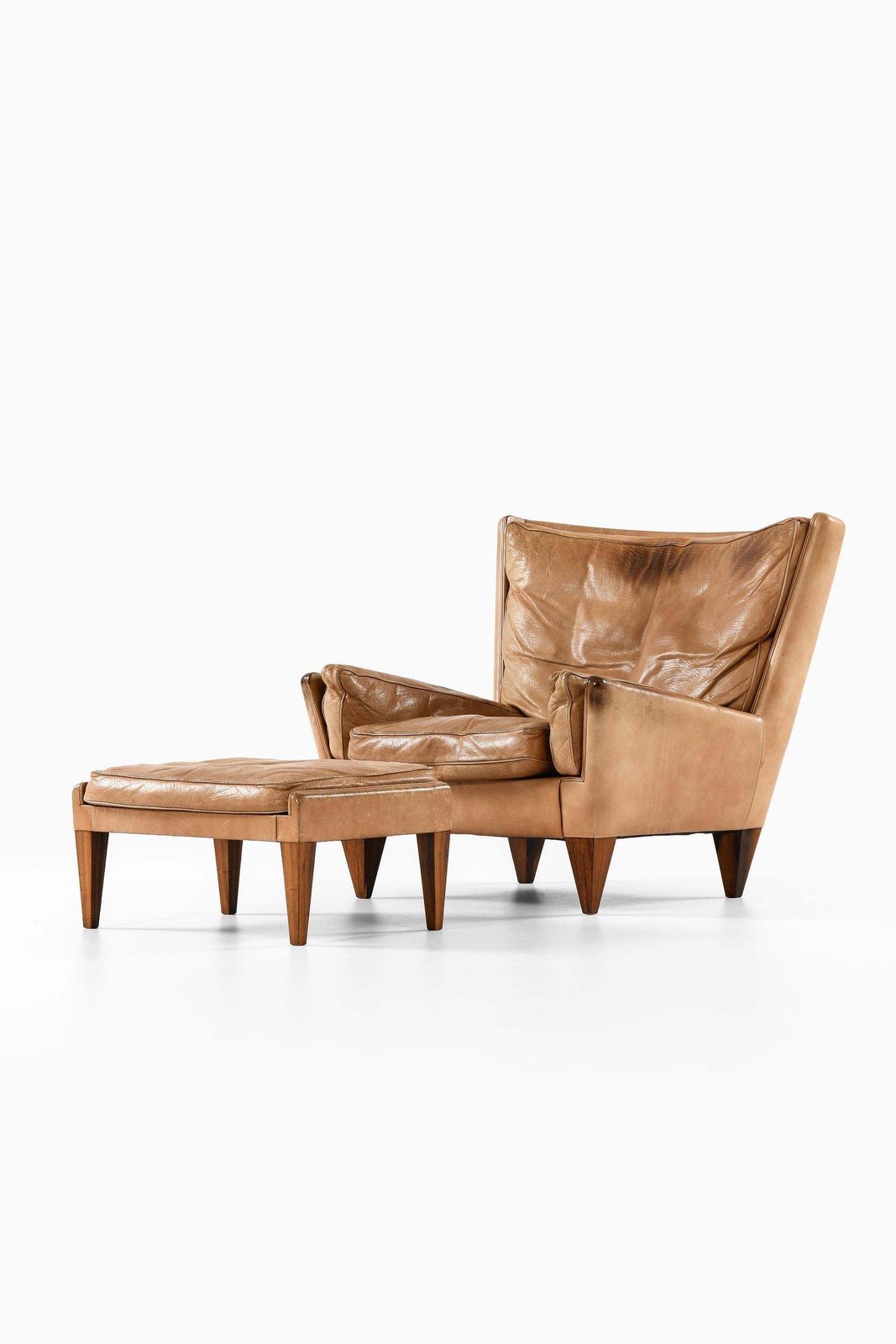 Easy Chair In Leather And Rosewood With Stool By Illum Wikkelsø, 1960s photo for sale