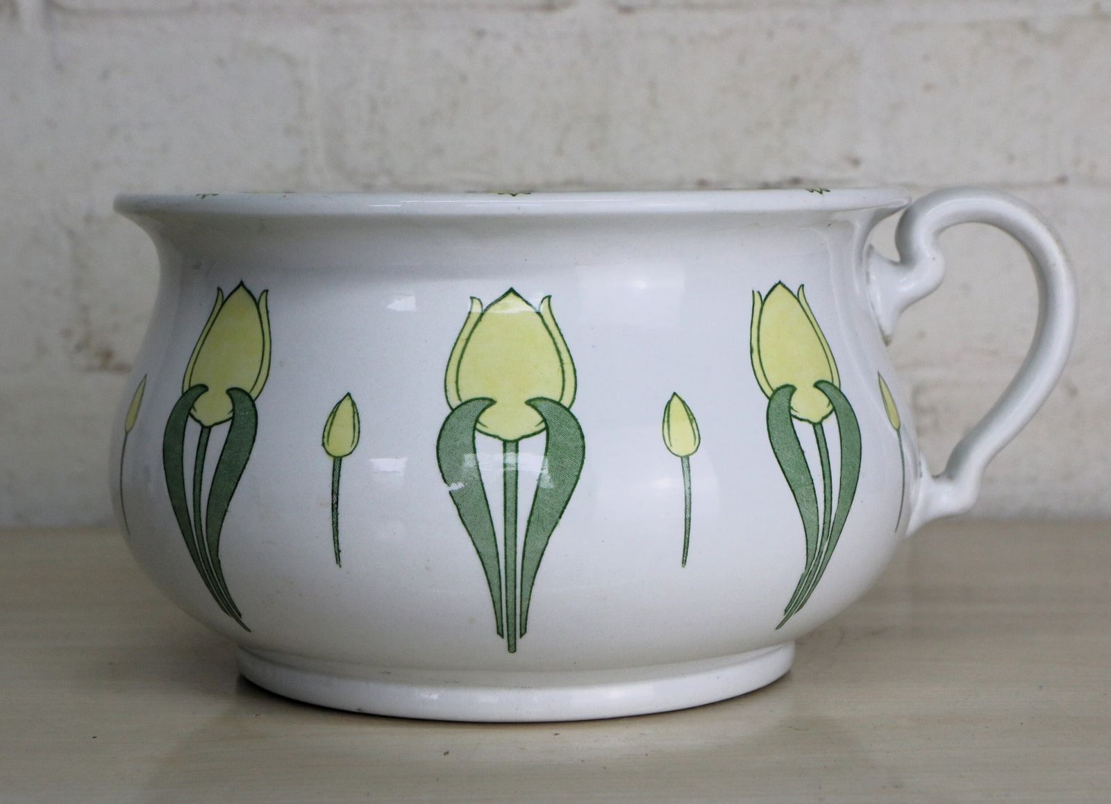 An Art Nouveau Decorative Ceramic Chamber Pot With Stylised Yellow Tulips